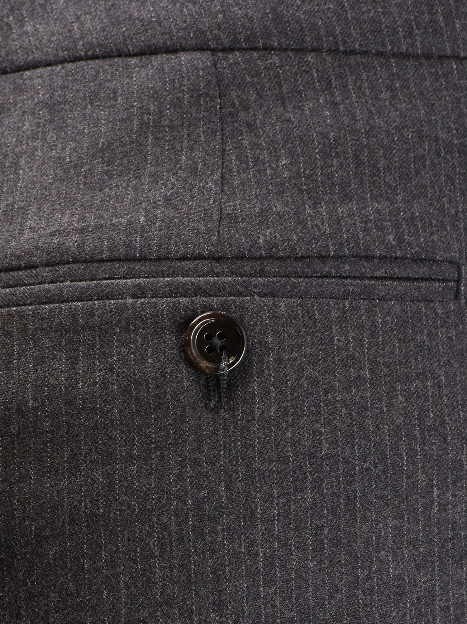 Pinstripe wool trousers.webp