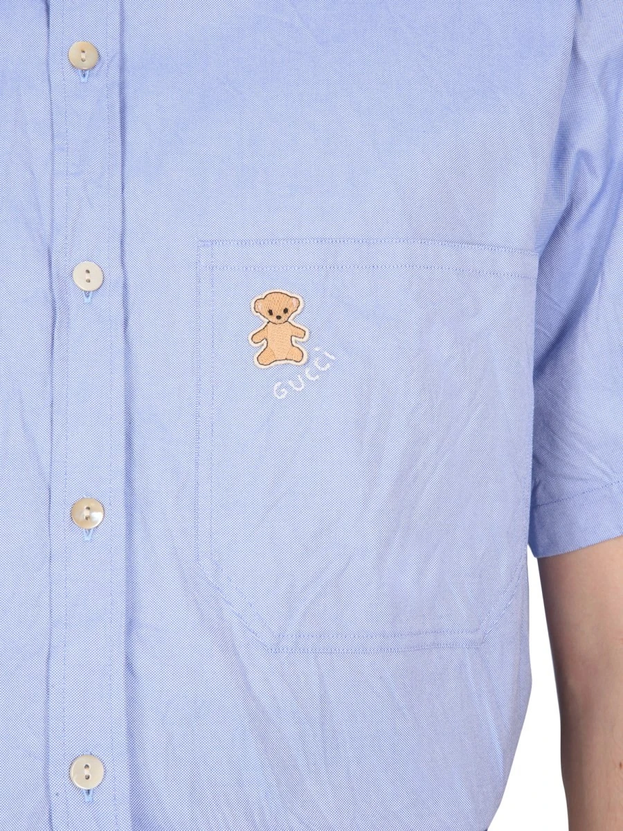 SHIRT WITH BEAR ON POCKET.webp