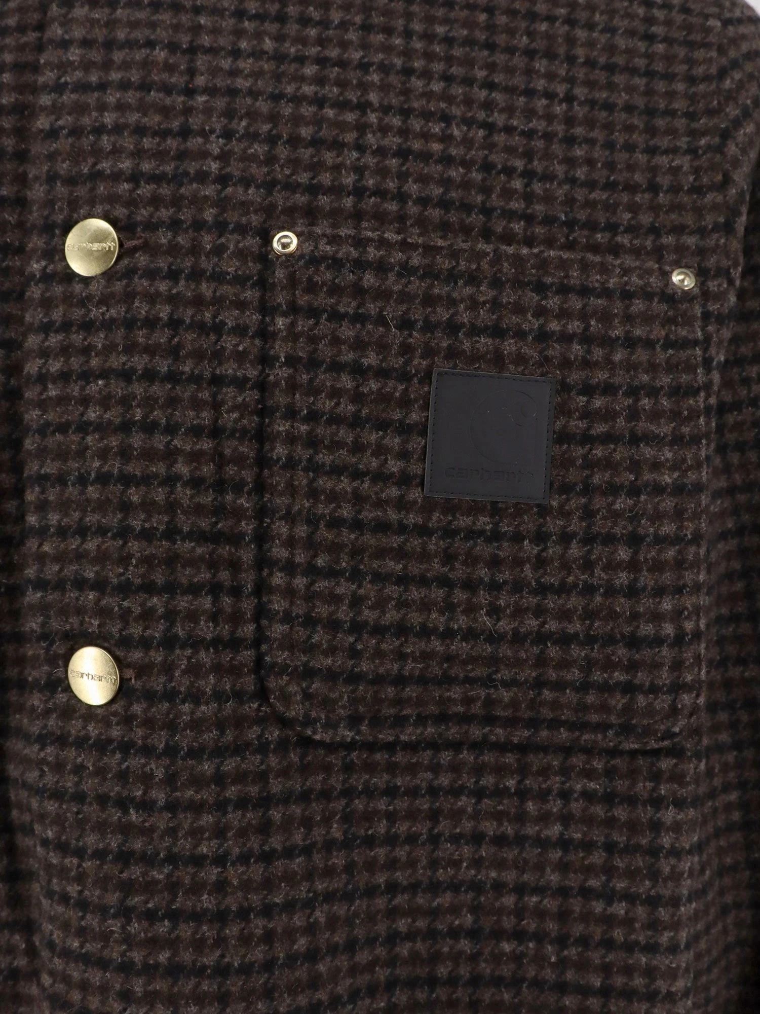 Lowis jacket with houndstooth pattern.webp