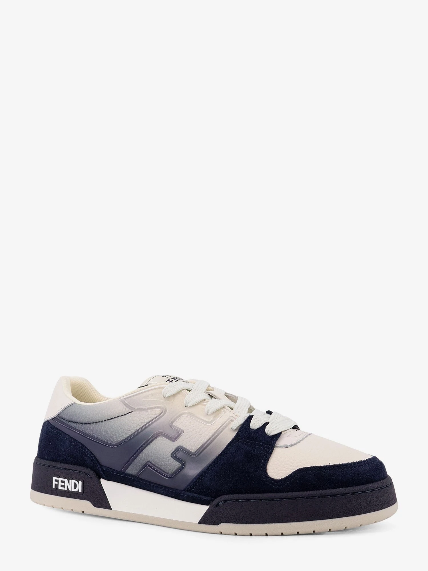 Match leather sneakers with suede inserts.webp