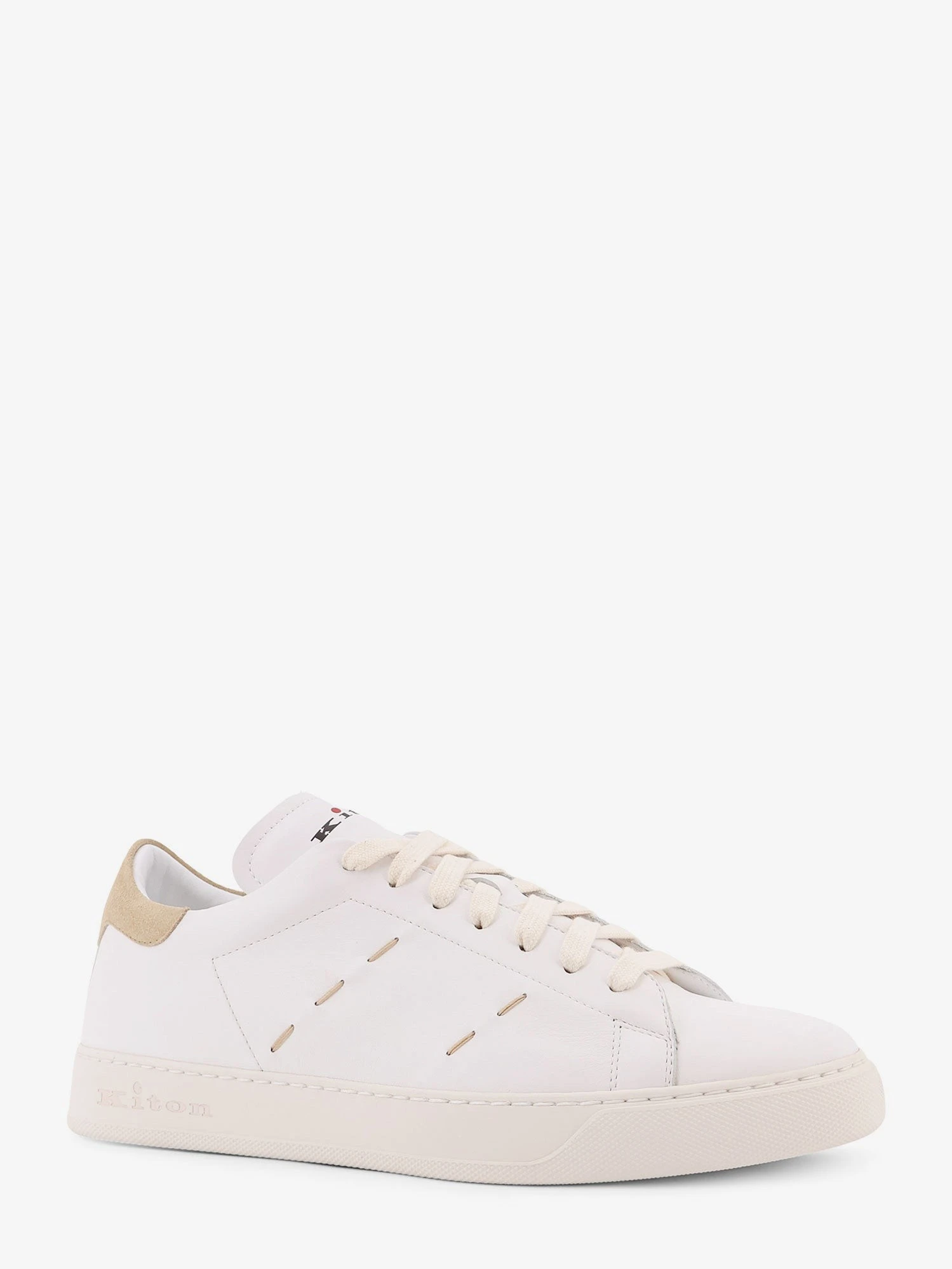 Leather sneakers with iconic stitching.webp