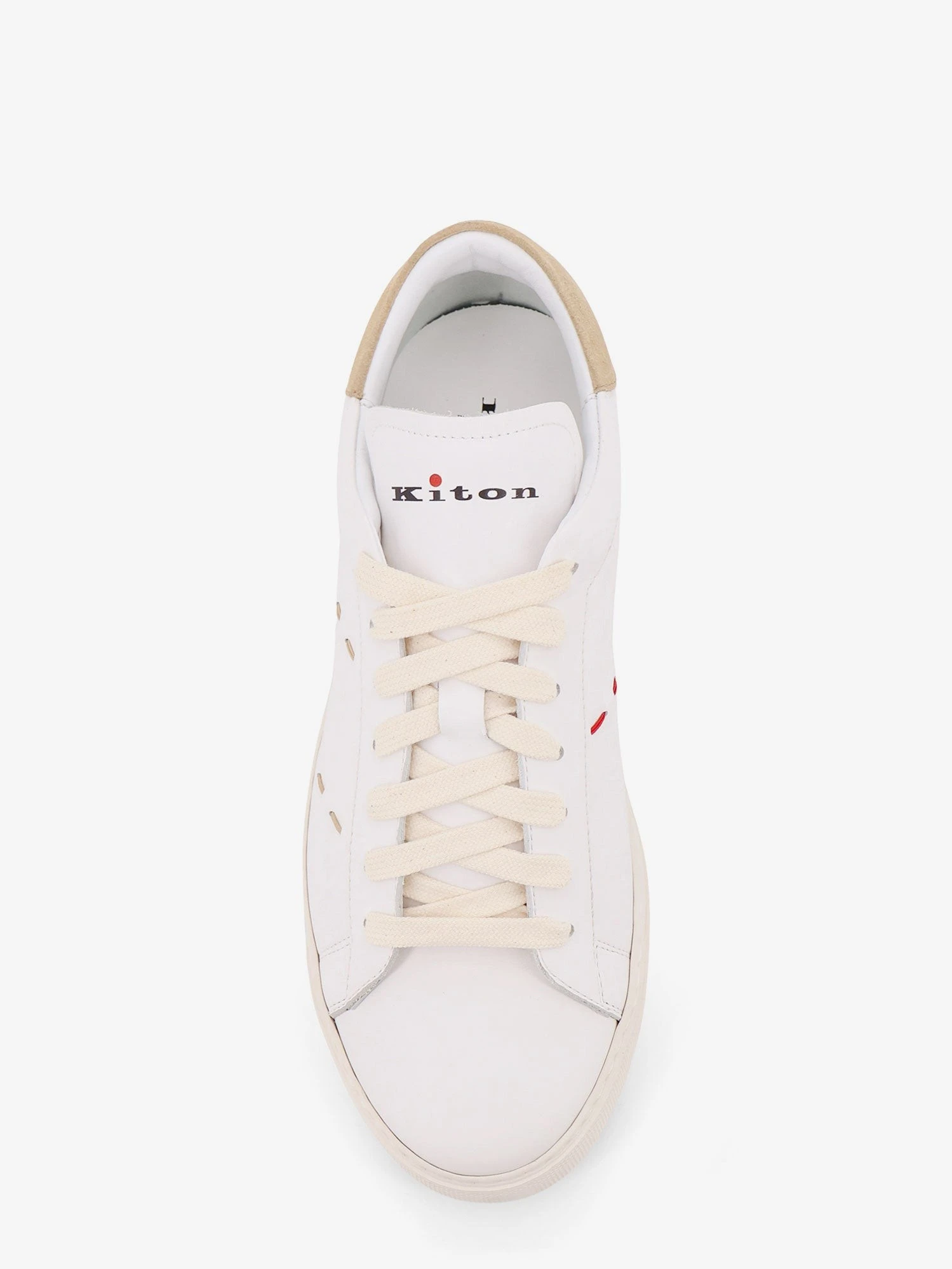 Leather sneakers with iconic stitching.webp