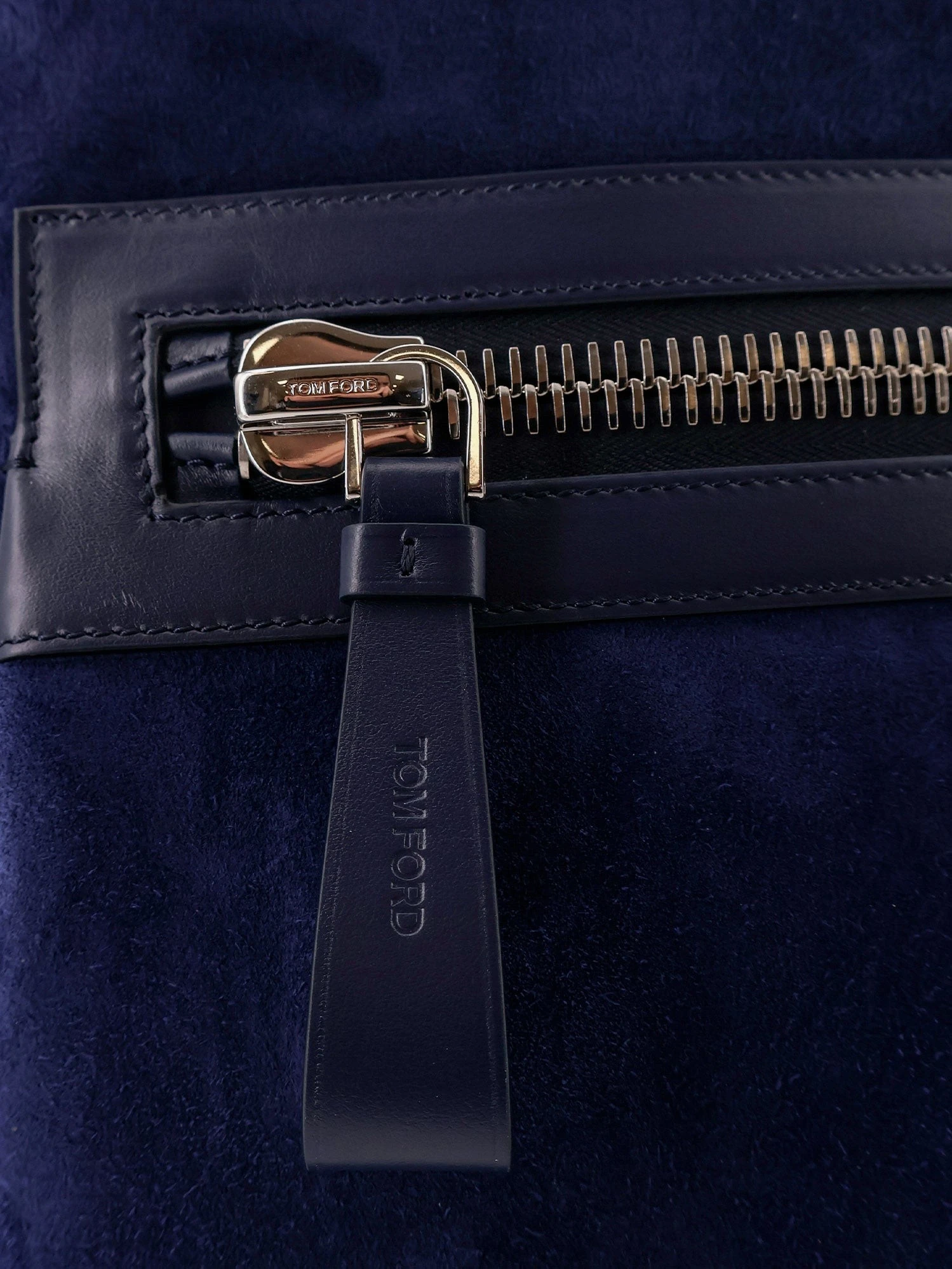 Suede backpack with maxi zip on the front.webp