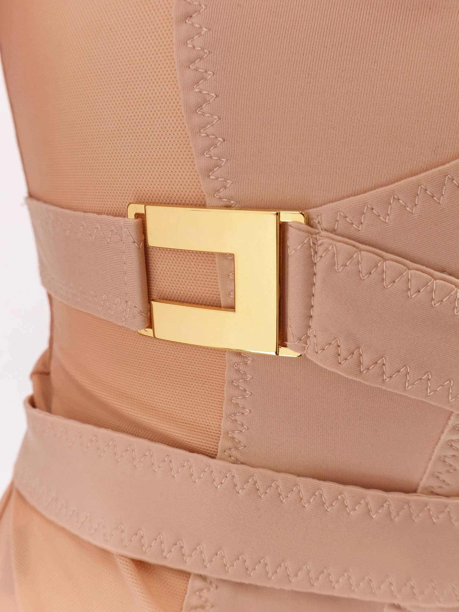 Stretch fabric top with metal details.webp