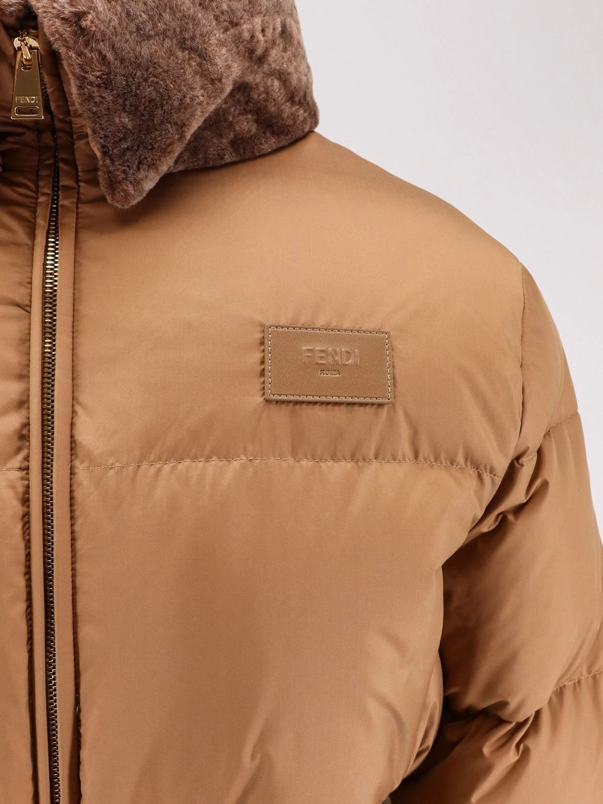 Technical fabric and shearling down jacket.webp
