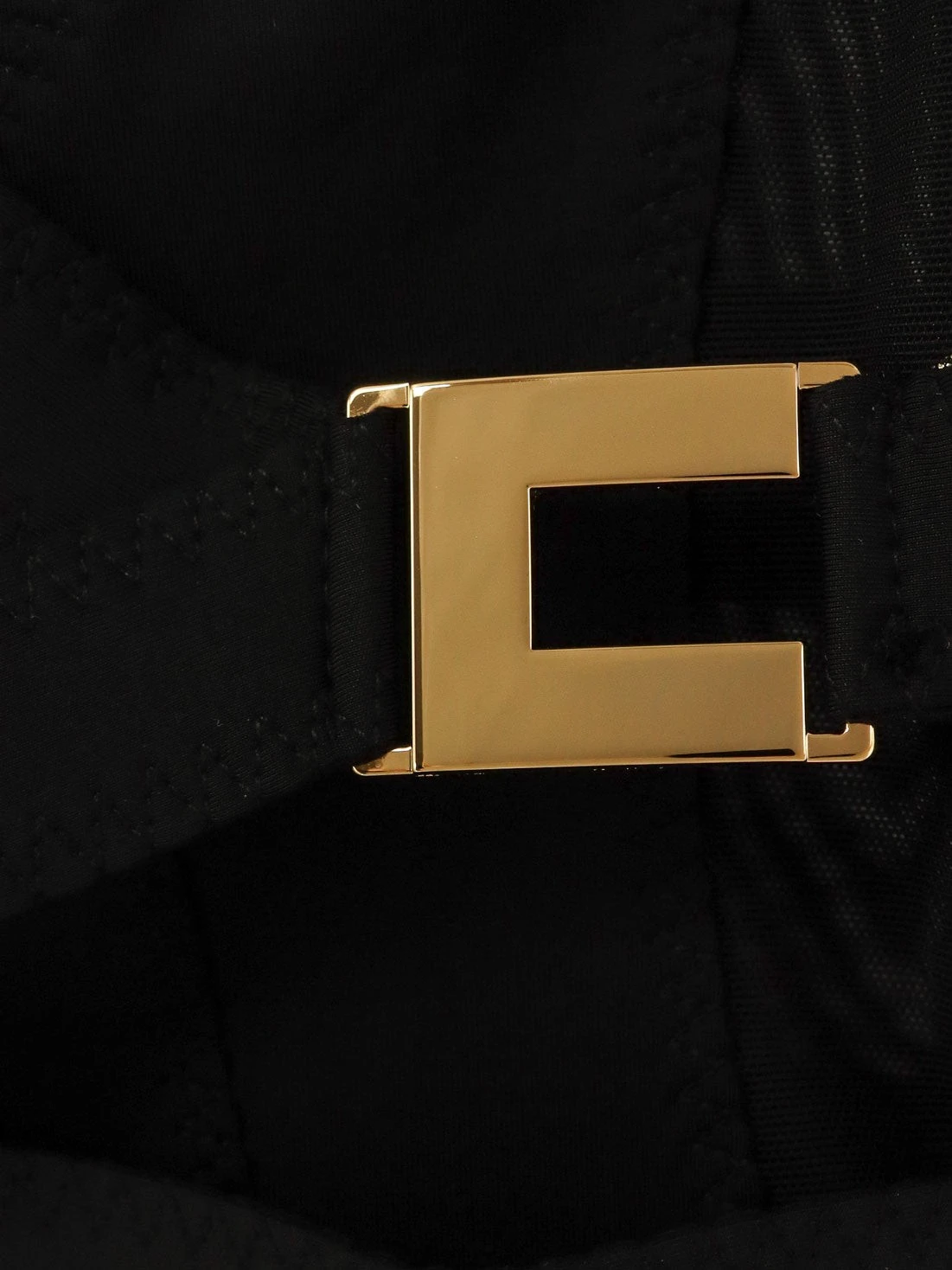 Stretch fabric top with metal details.webp