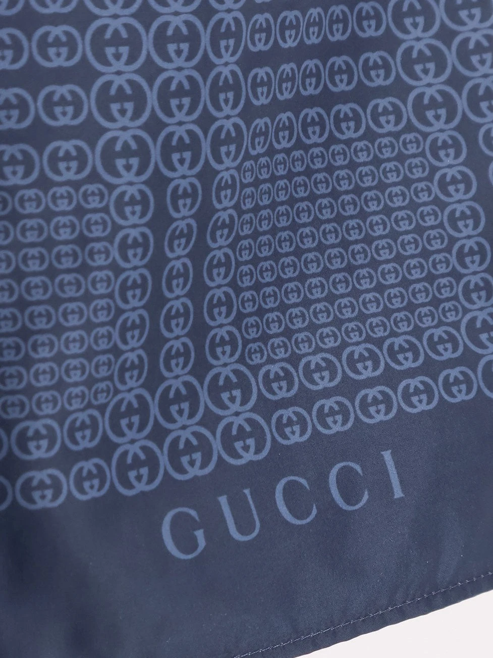 Nylon swim trunks with all-over Gucci Incrocio print.webp