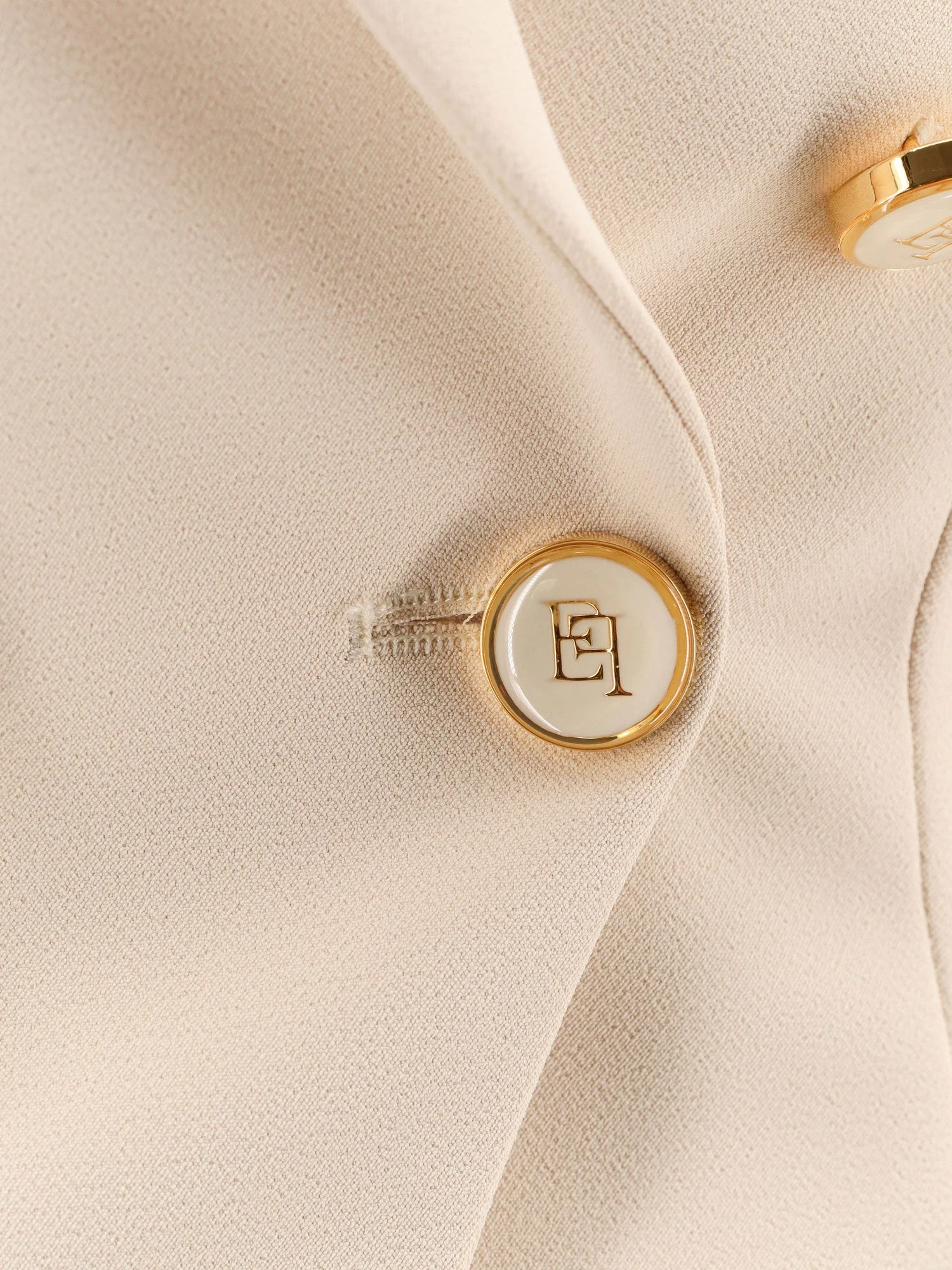 Fitted blazer with logoed buttons.webp