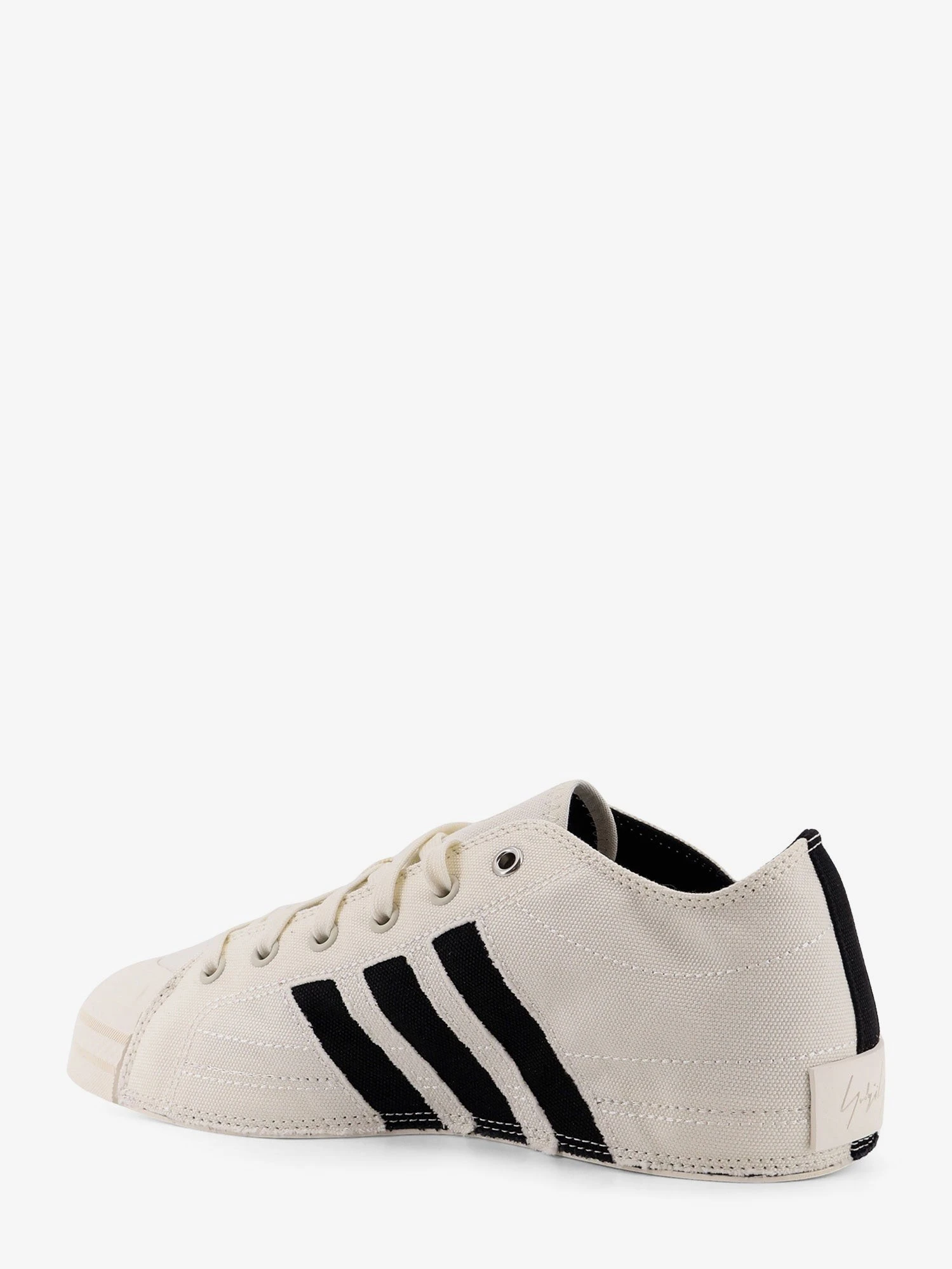 Canvas sneakers with logo on the side.webp