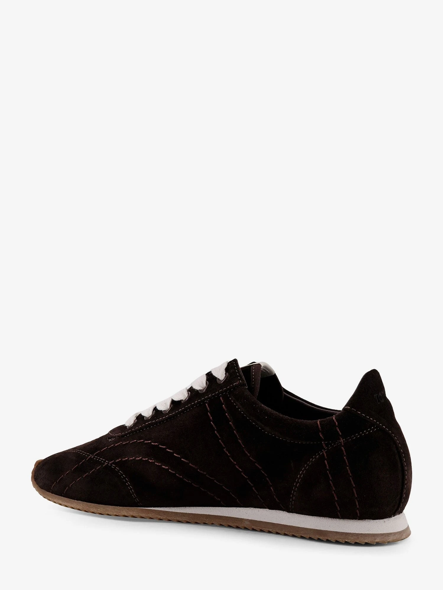 Leather sneakers with stitching detail.webp