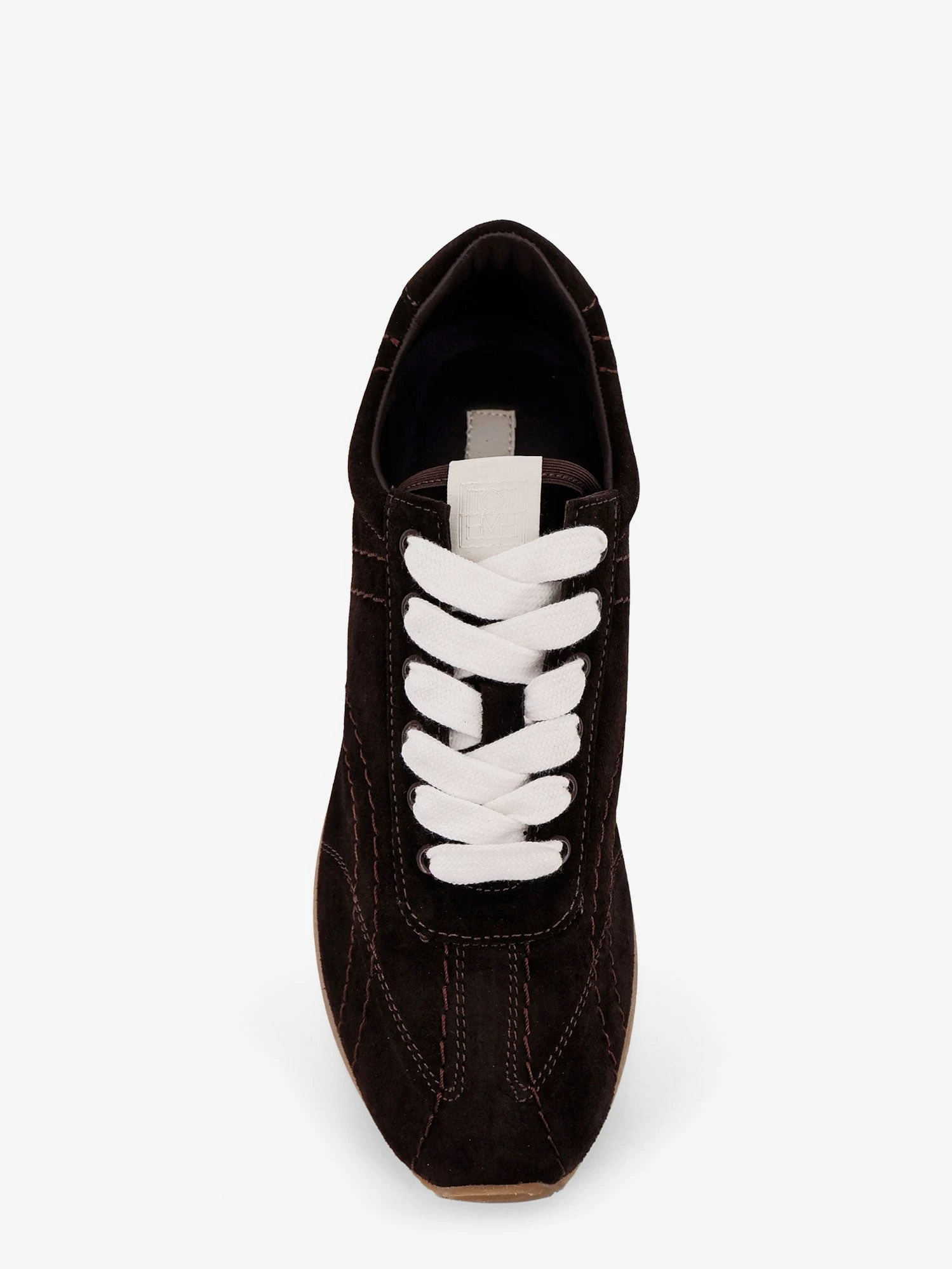 Leather sneakers with stitching detail.webp