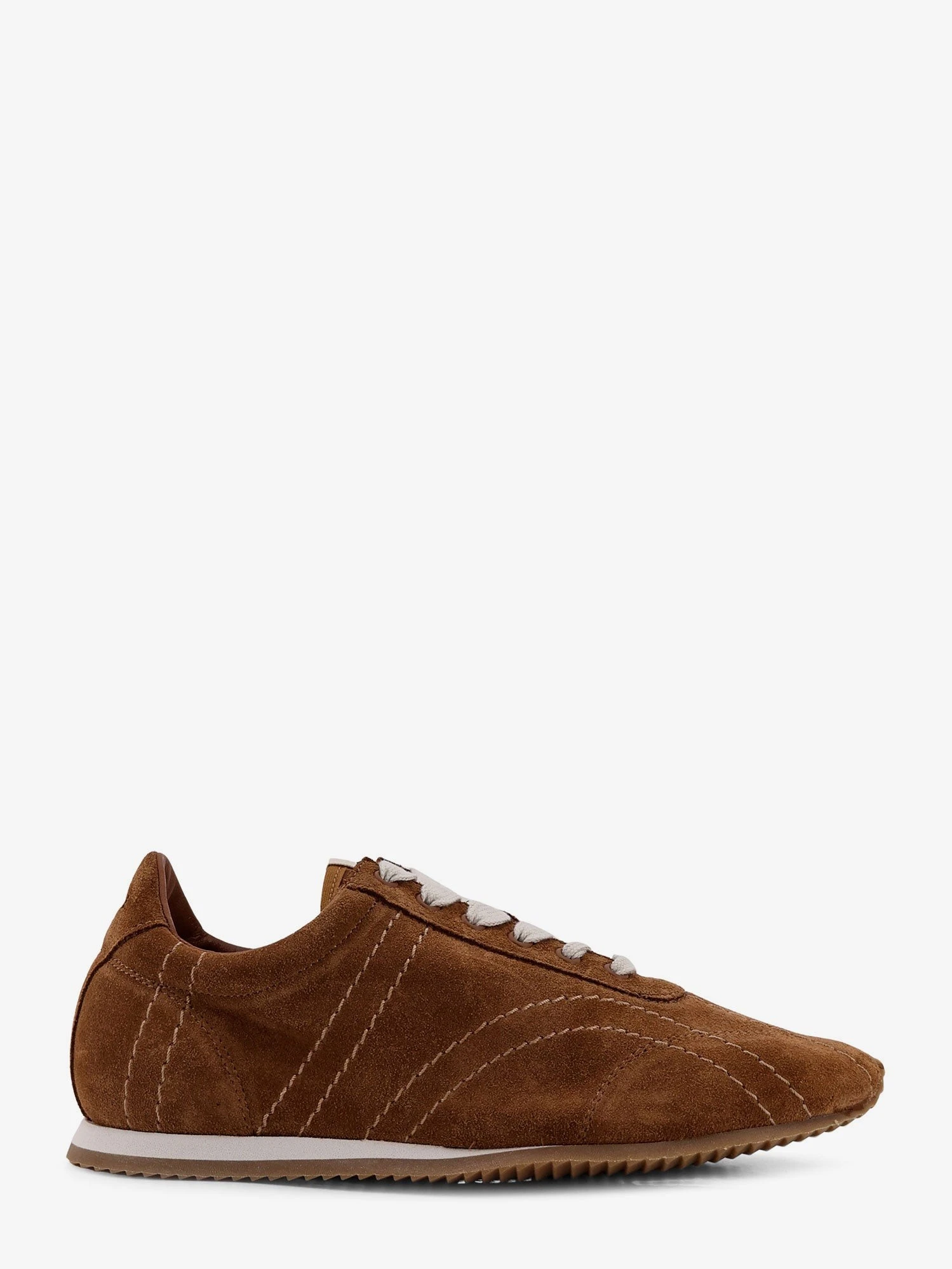 Leather sneakers with stitching detail.webp