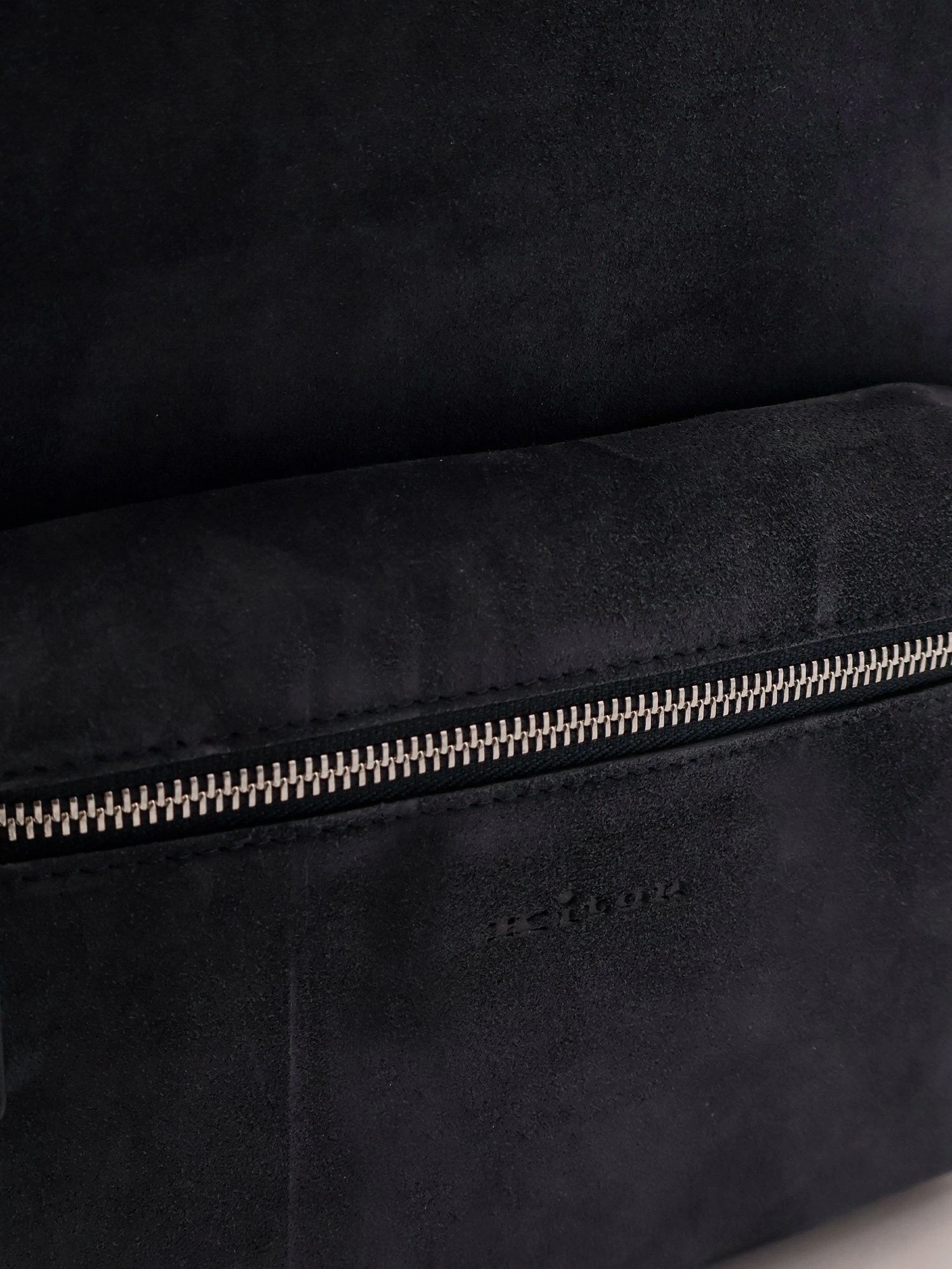 Suede backpack with engraved logo.webp