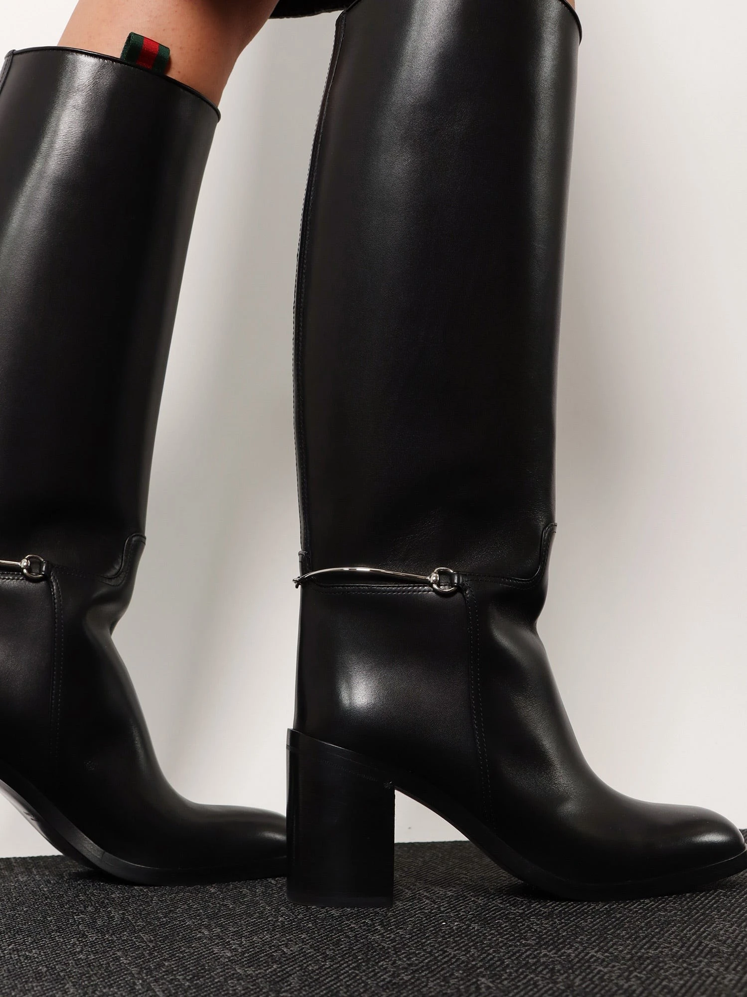 Leather boots with slim Horsebit detail.webp