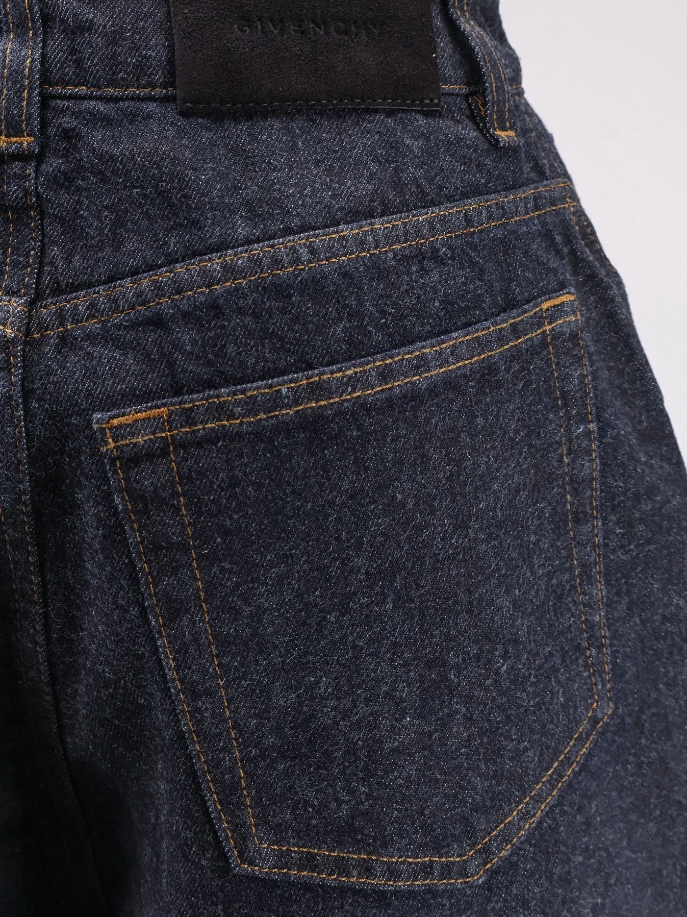 Twisted dark blue denim jeans.webp