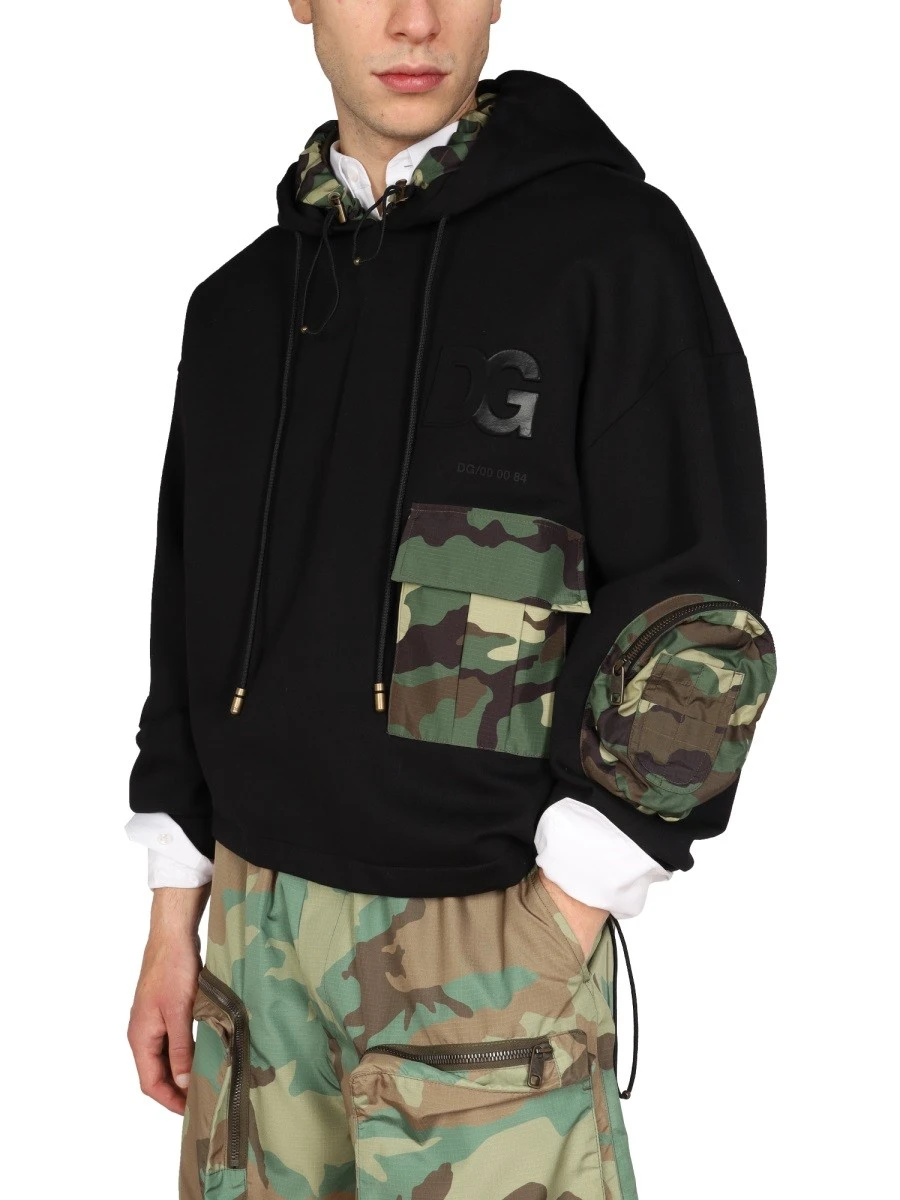 SWEATSHIRT WITH CAMO DETAILS.webp