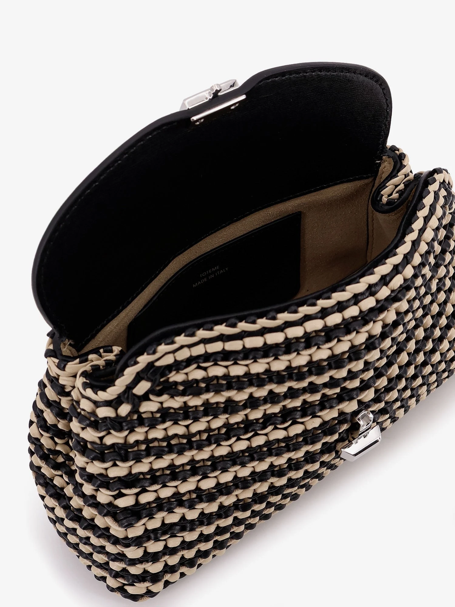 Mini T-lock clutch in leather with woven pattern.webp