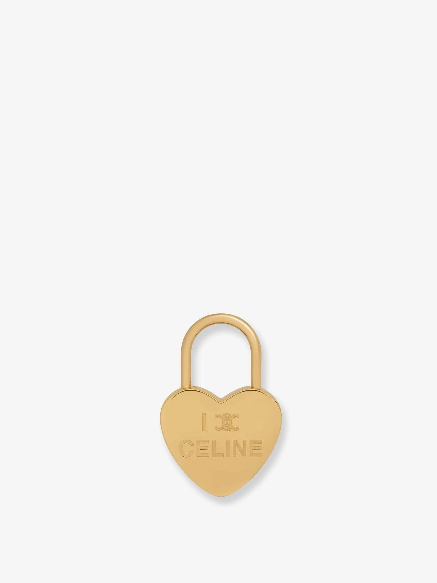 Heart-shaped brass charm.webp