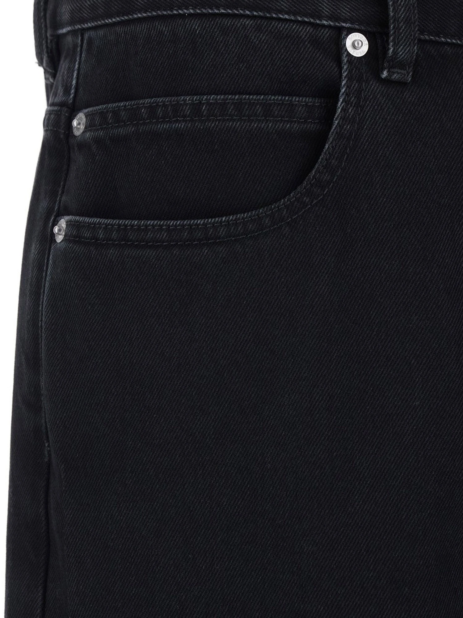 Black denim trousers.webp