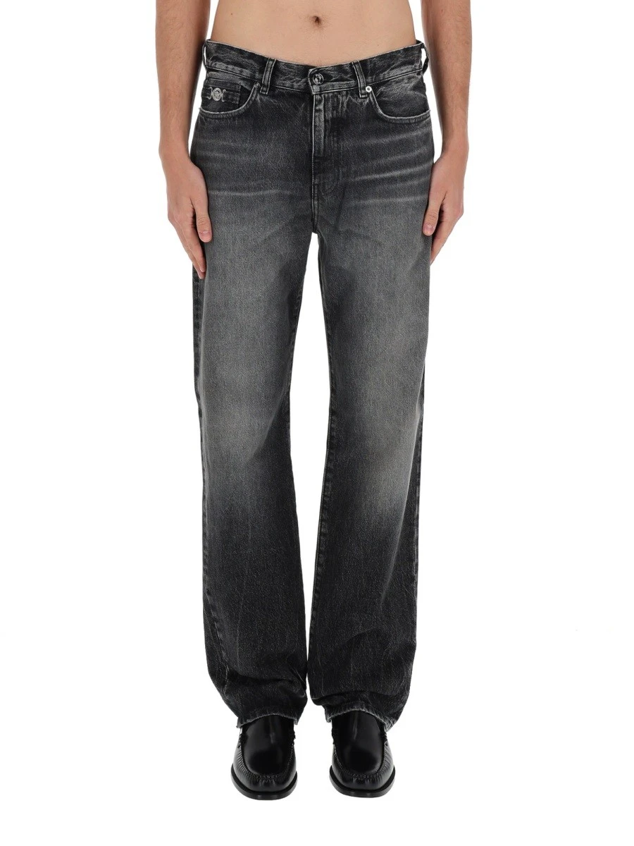 JEANS WITH "MEDUSA" DETAIL.webp