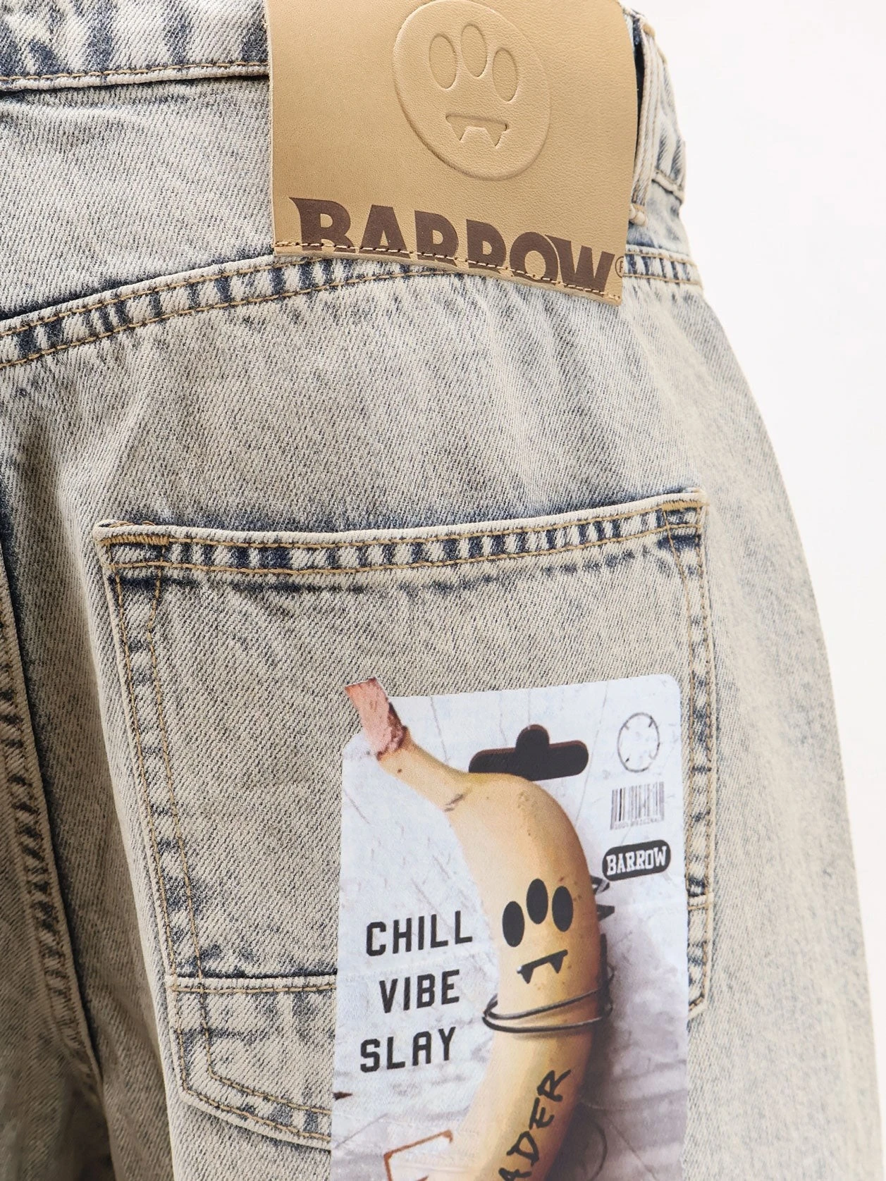 Cotton jeans with all-over print.webp