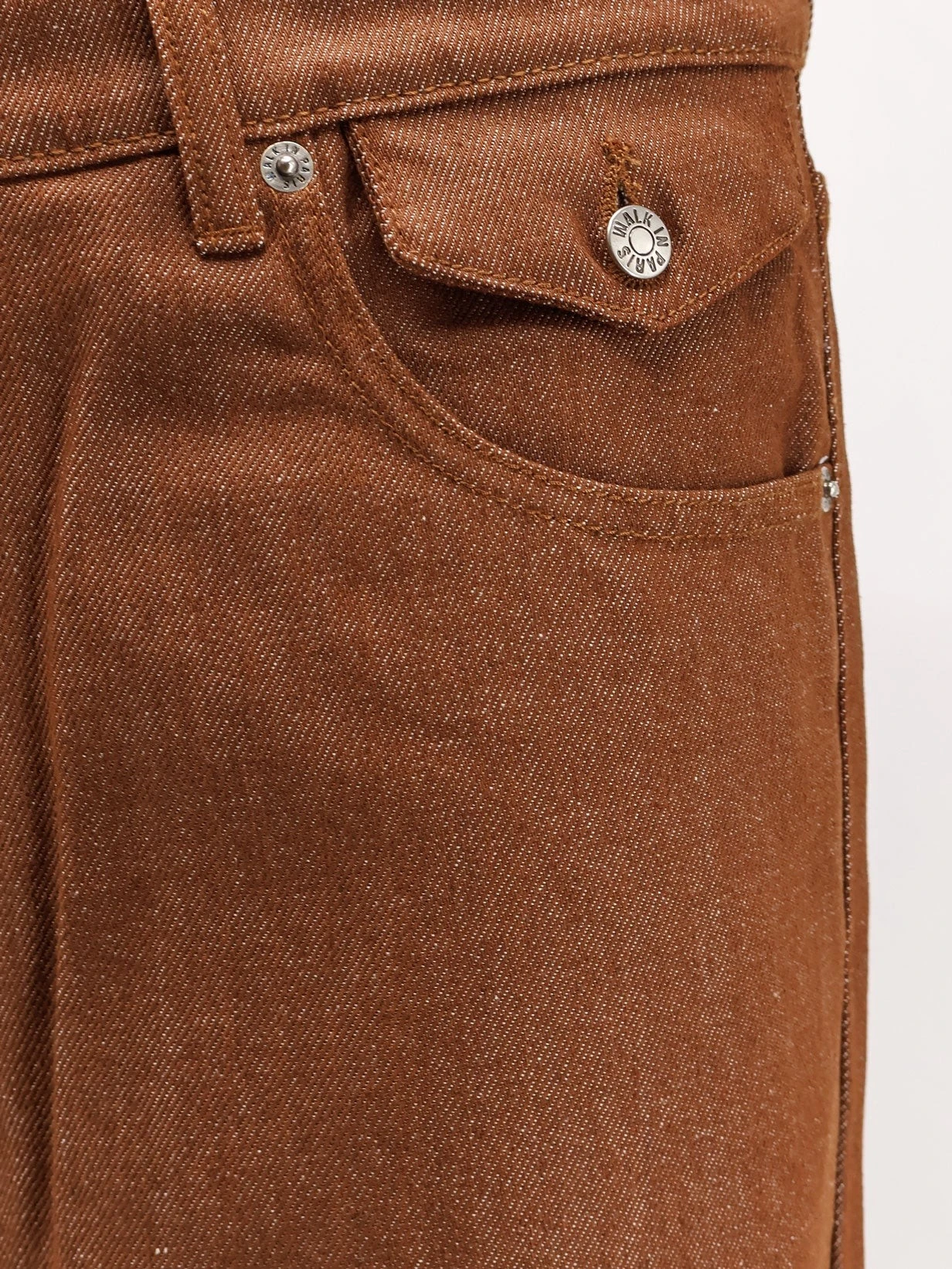 Baggy brown denim trousers.webp
