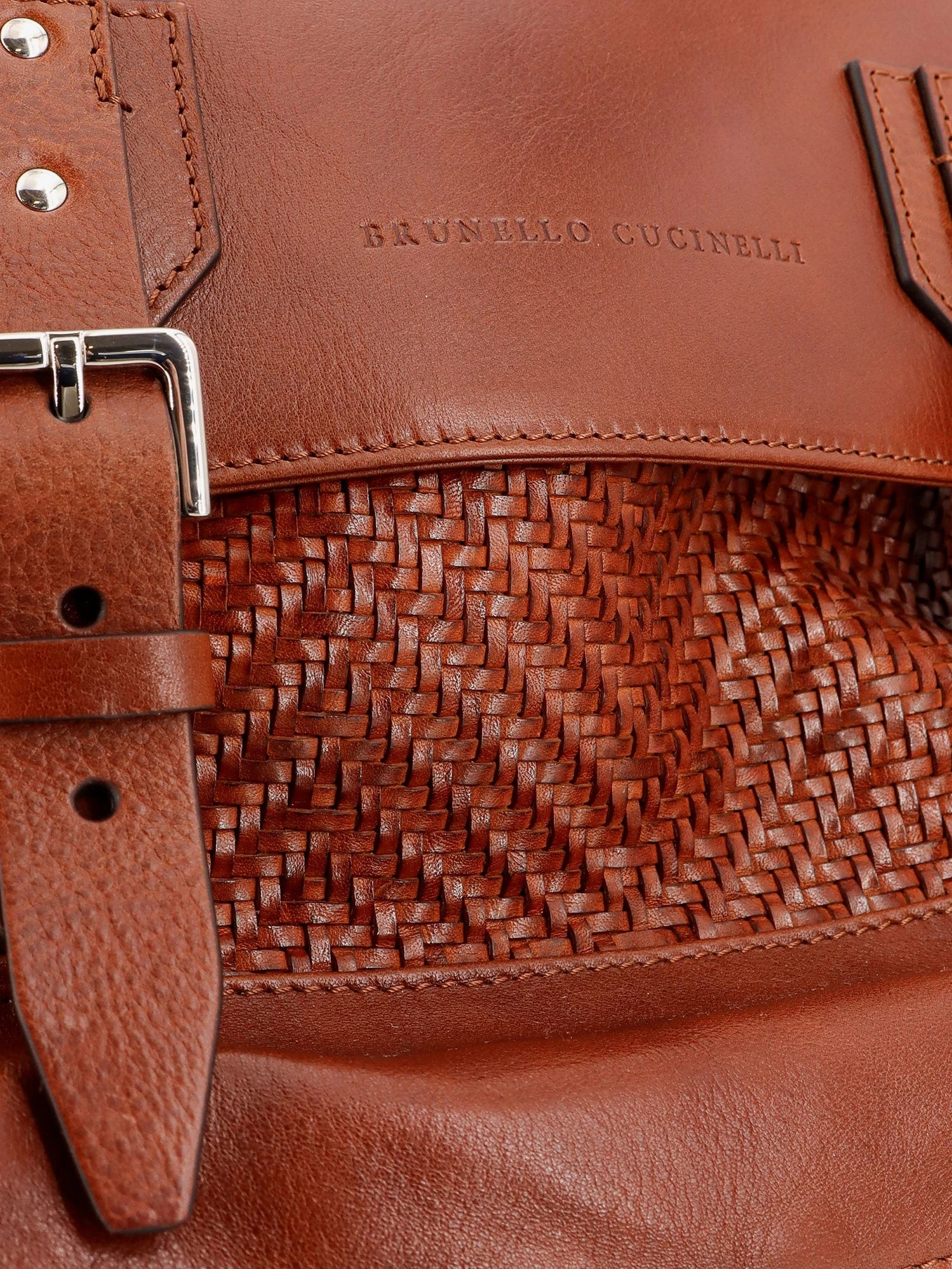 City leather backpack with engraved lettering logo.webp