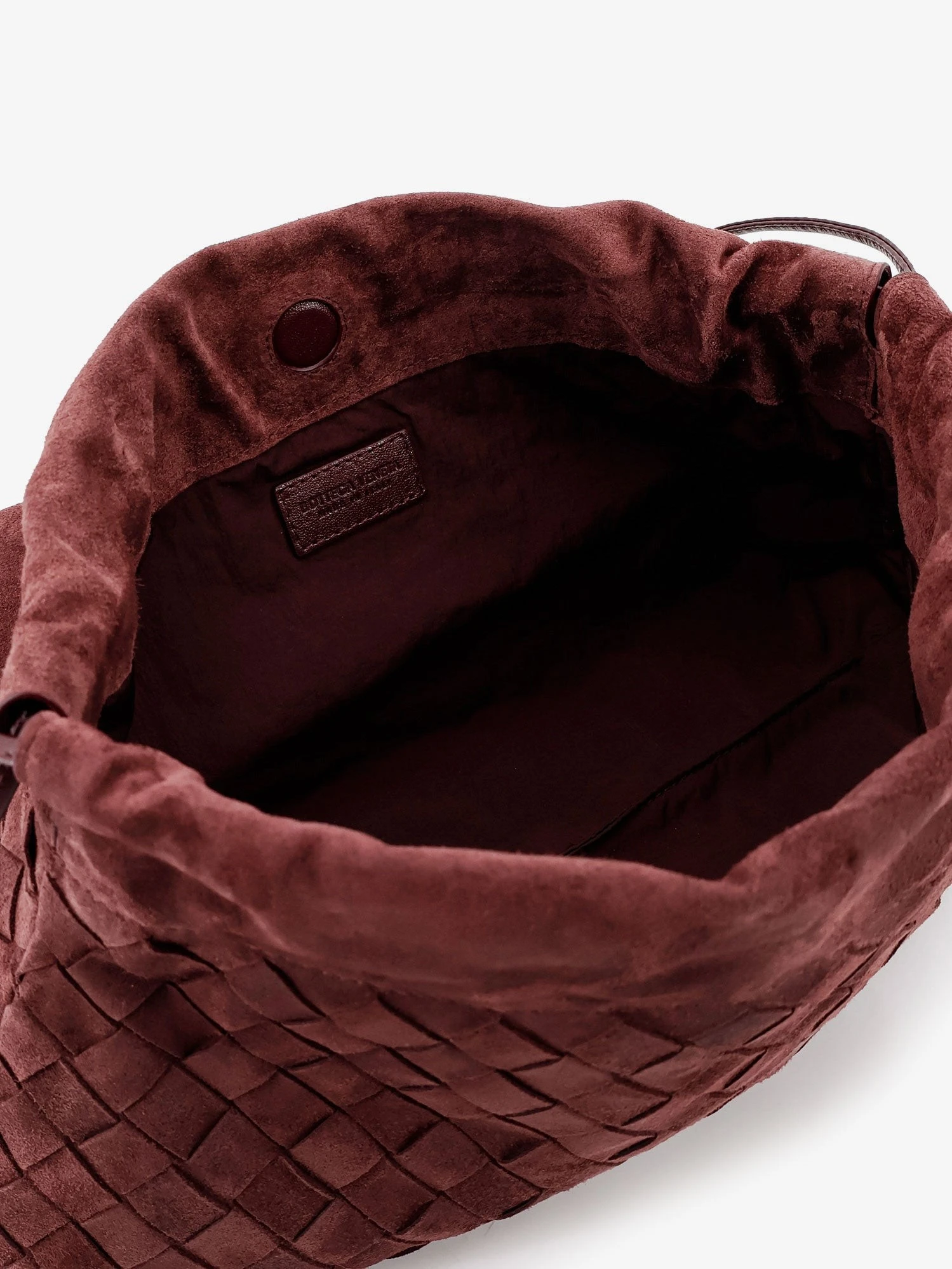 Suede Giorno crossbody bag with Intrecciato motif.webp