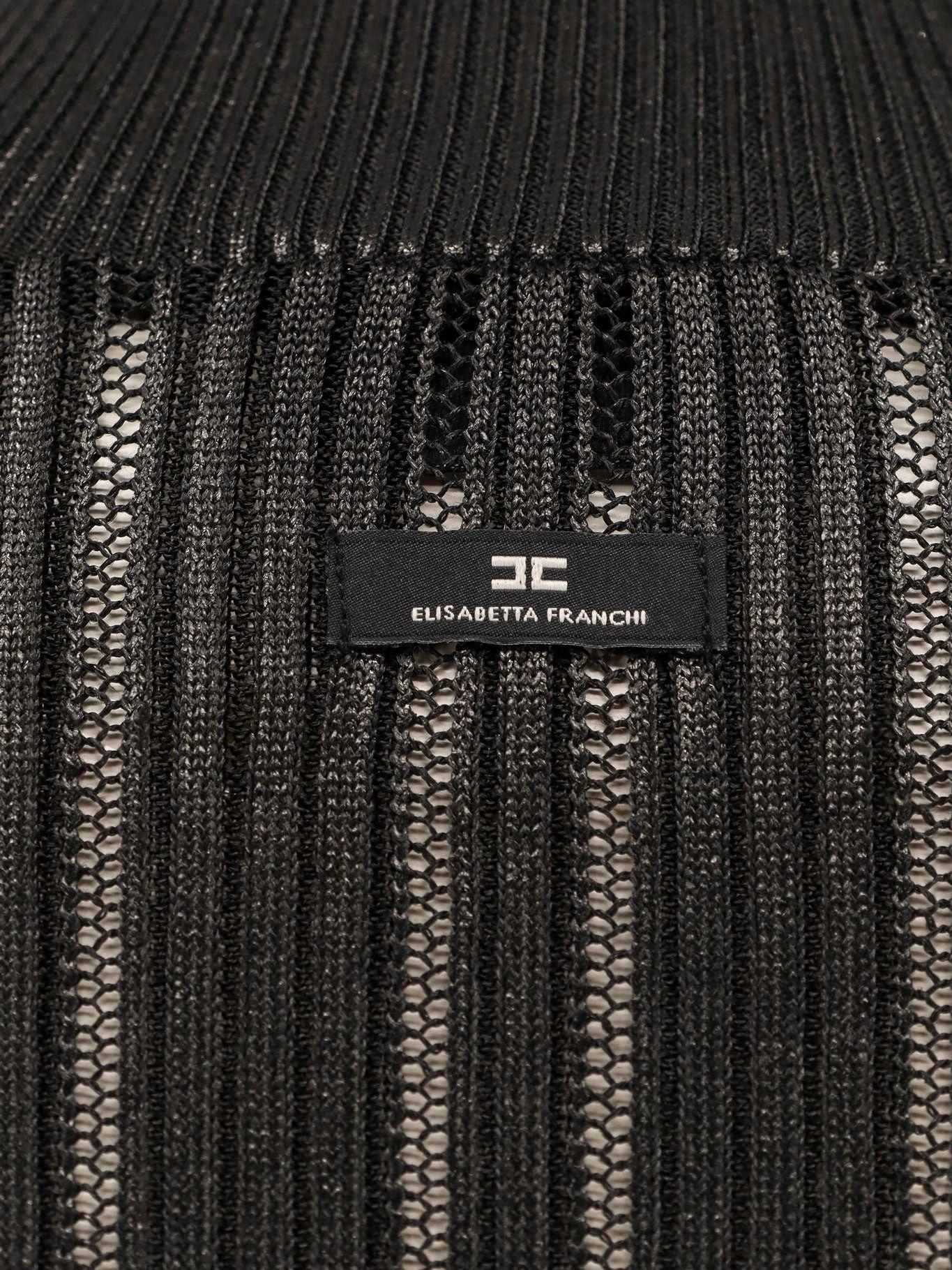 Metallic fabric turtleneck sweater.webp