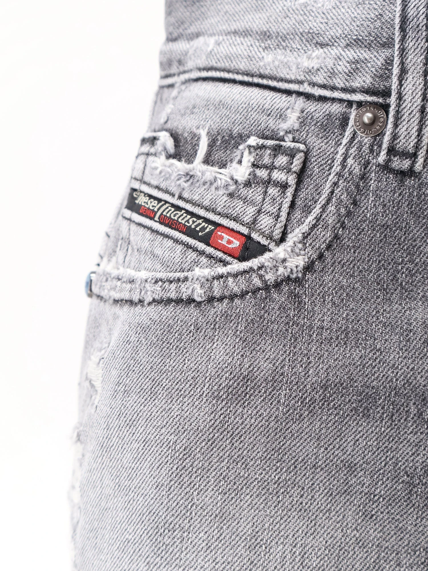 Blue denim shorts with a destroyed effect.webp