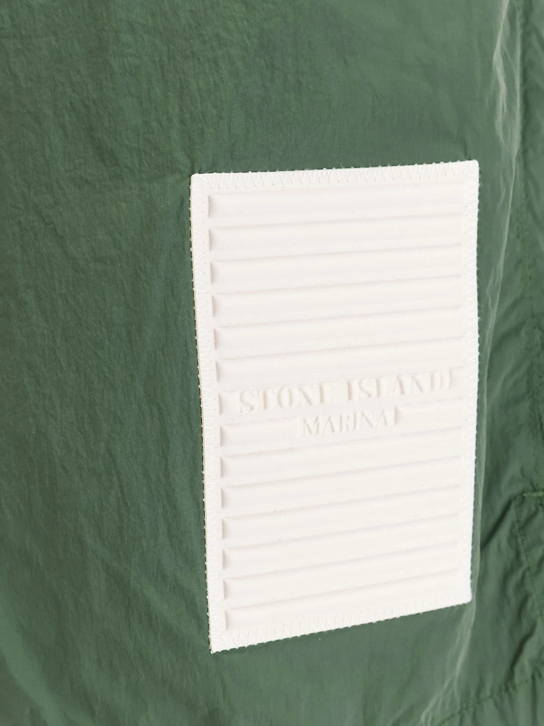 Nylon swim trunks with contrasting logo patch.webp