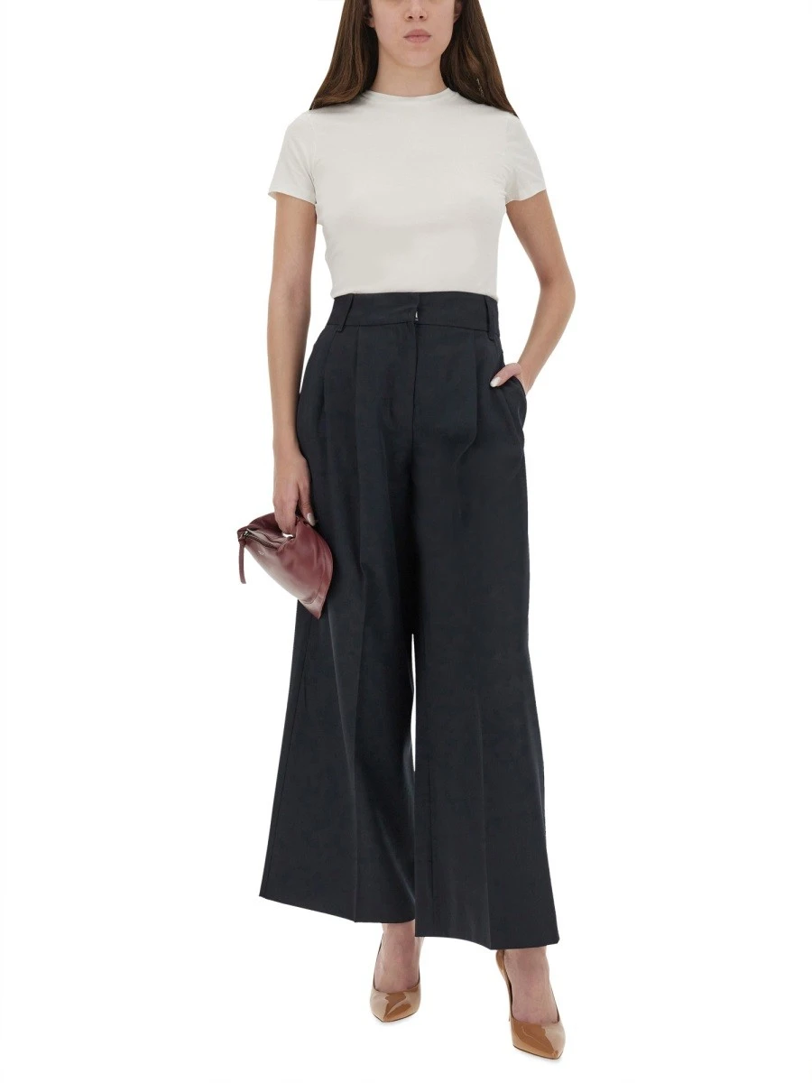 Coated canvas bucket bag with check pattern.webp