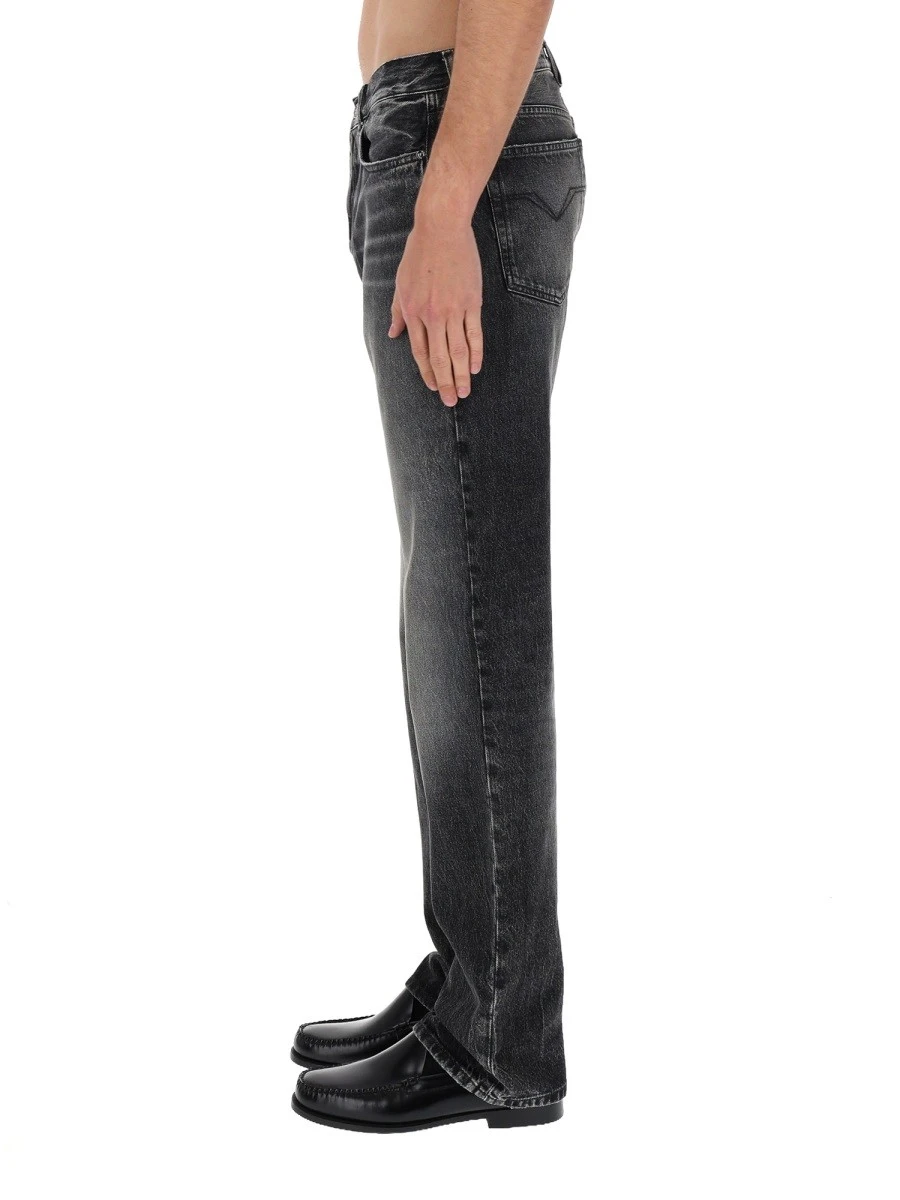 JEANS WITH "MEDUSA" DETAIL.webp