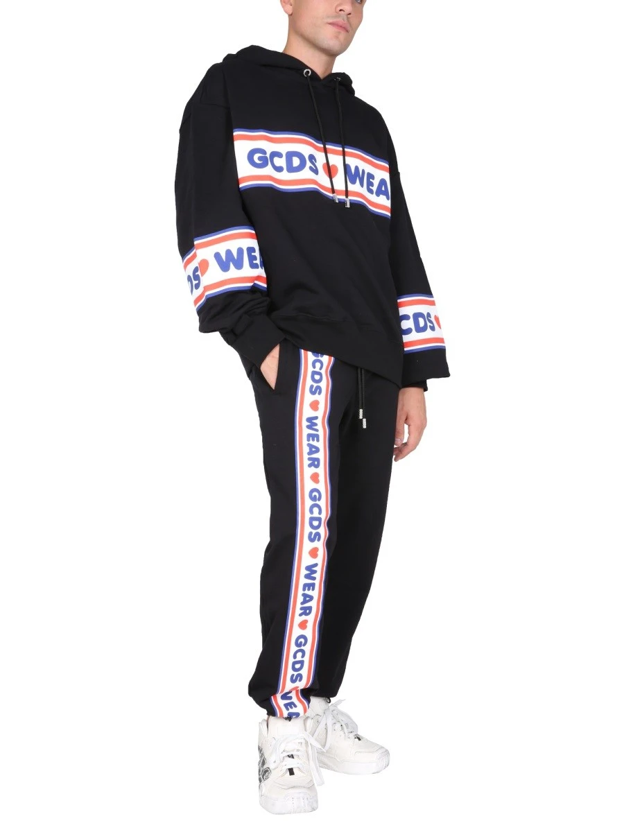 JOGGING PANTS WITH "CUTE TAPE" LOGO BAND.webp