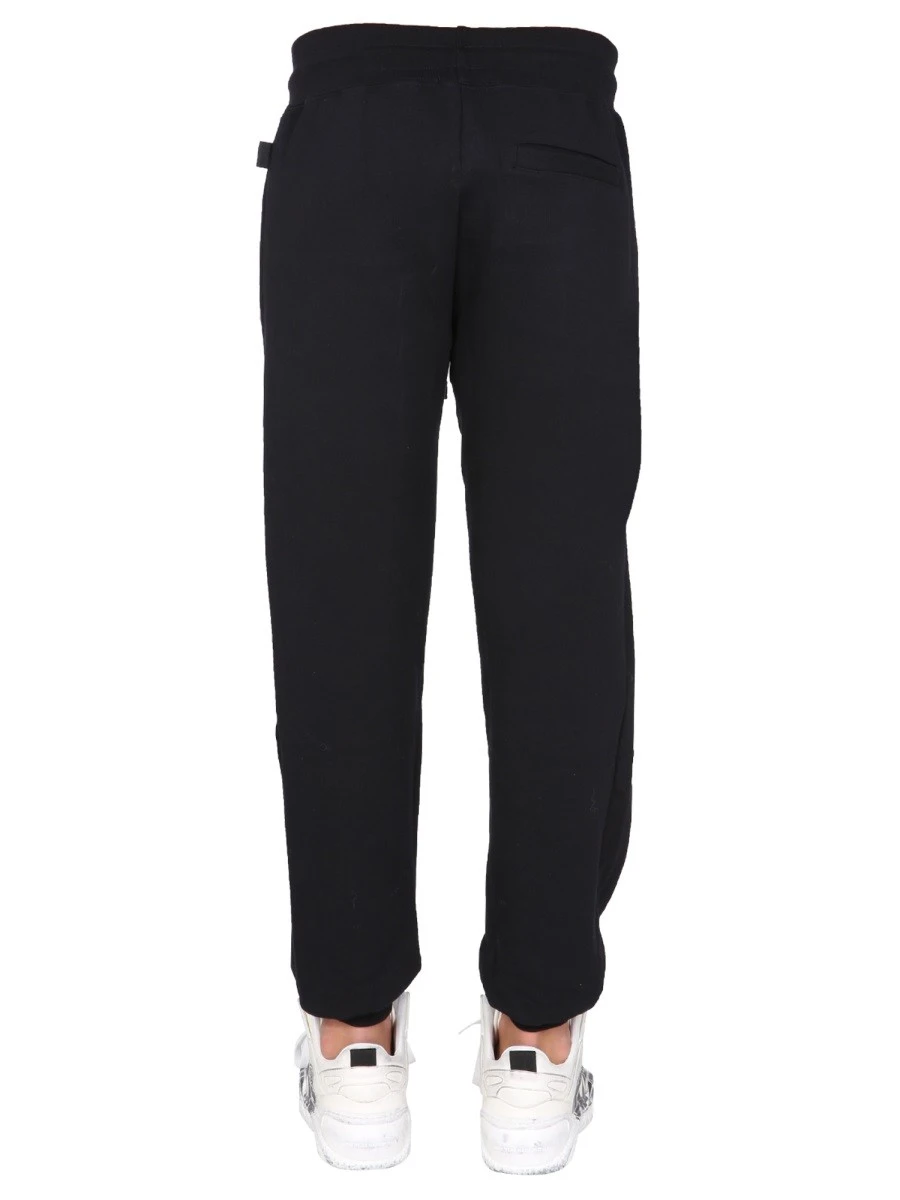 JOGGING PANTS WITH "CUTE TAPE" LOGO BAND.webp