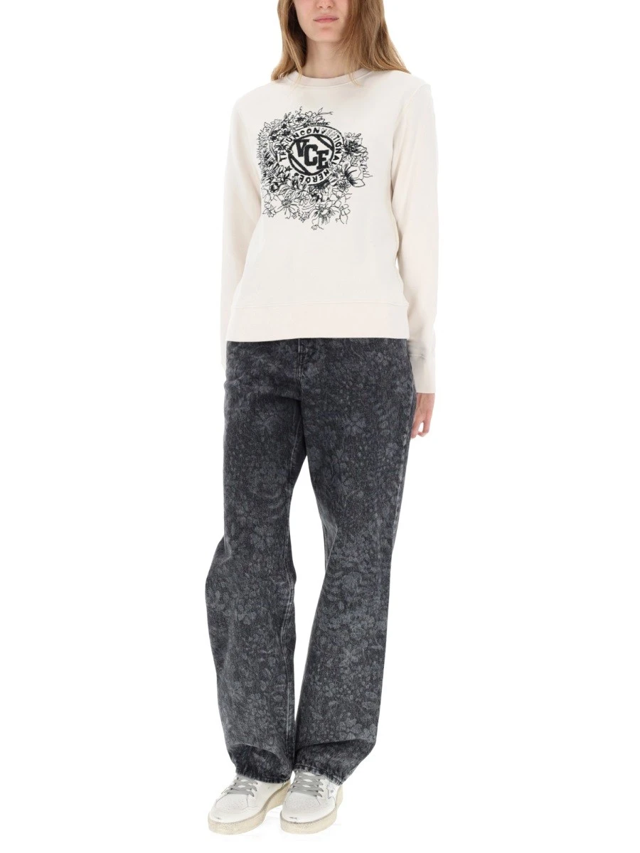 JEANS WITH FLORAL PATTERN.webp