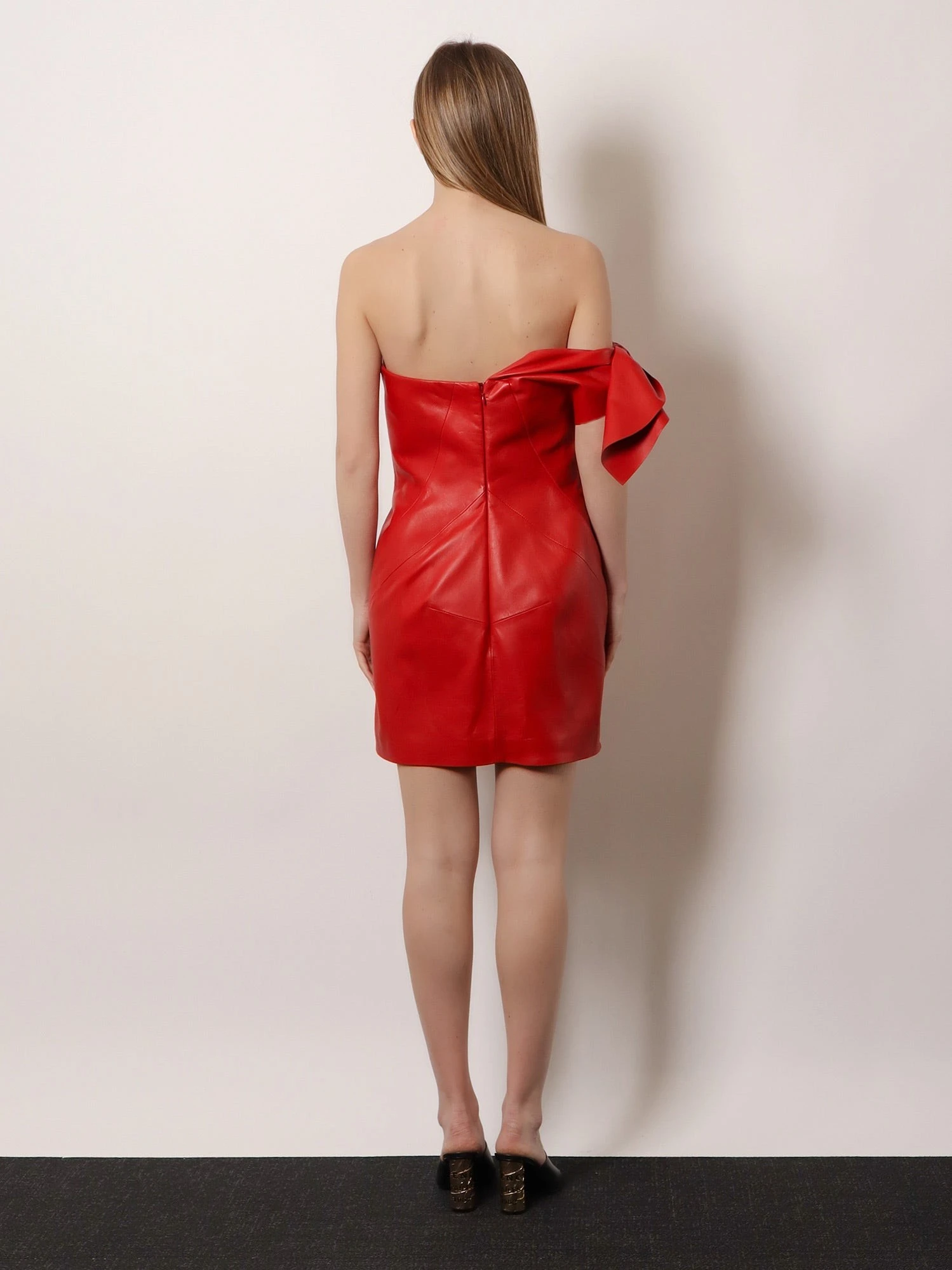 Leather bustier dress with bow detail.webp