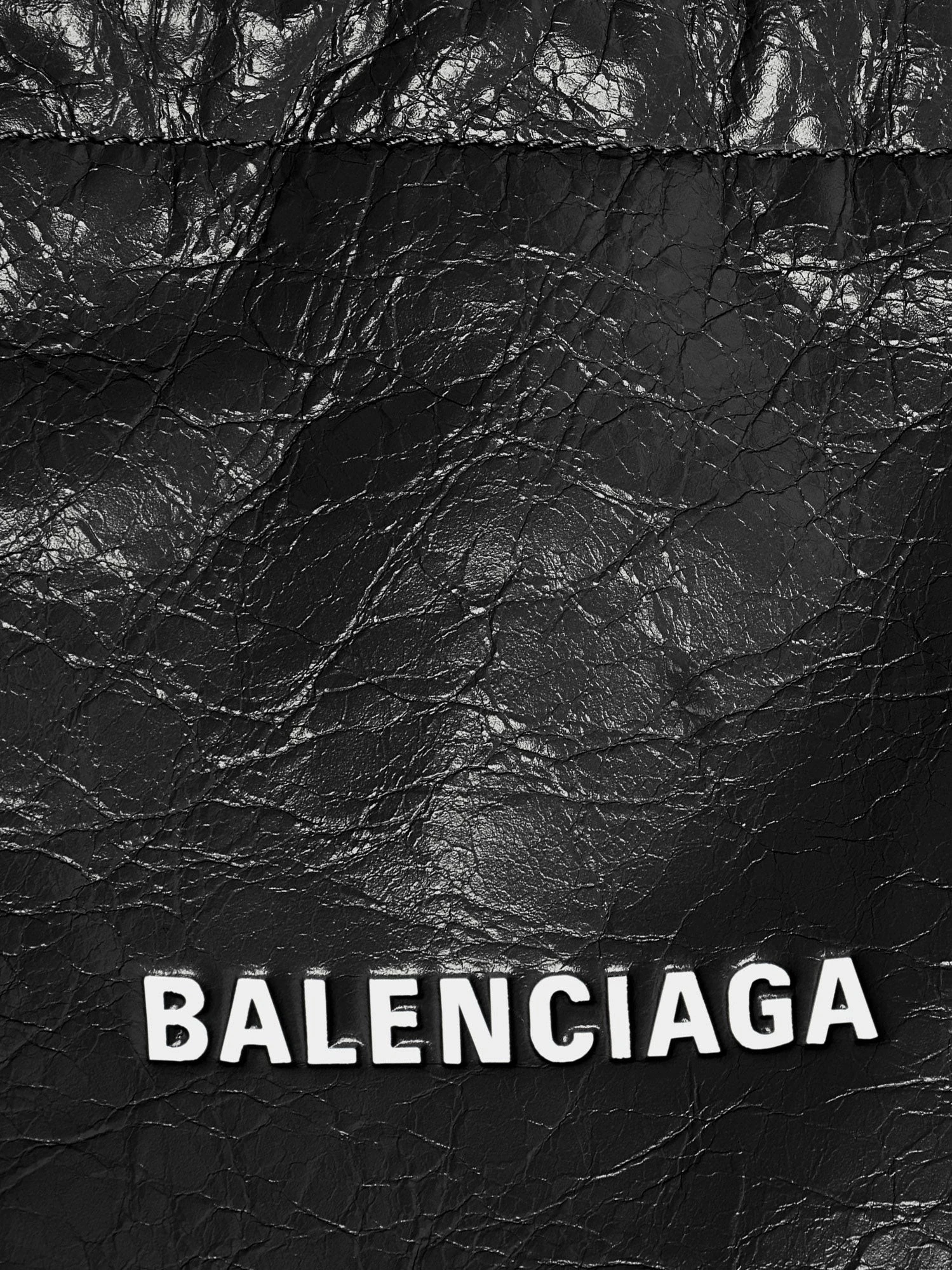 Leather Shopper Phone Holder with lettering logo on the front.webp