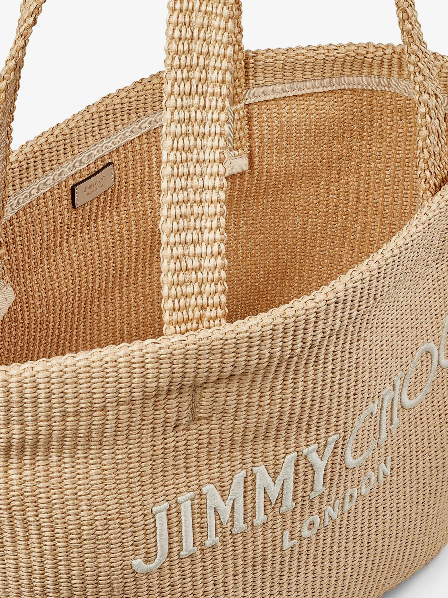 Raffia shopping bag with lettering logo on the front.webp