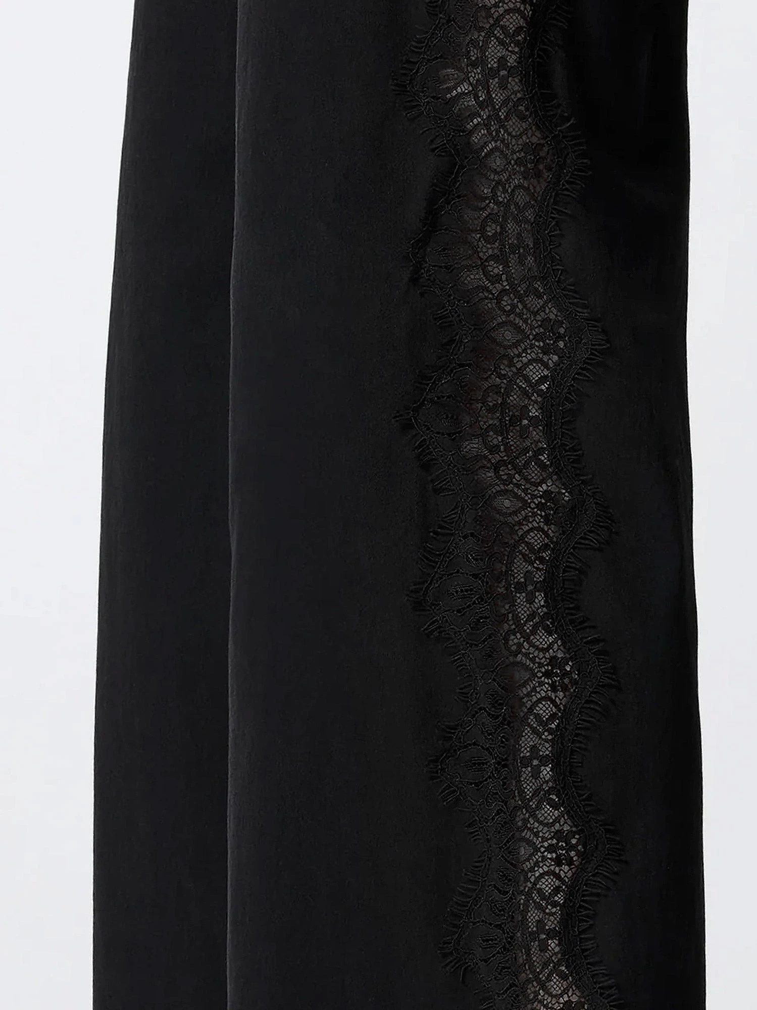 Denim trousers with lace detail on the side.webp