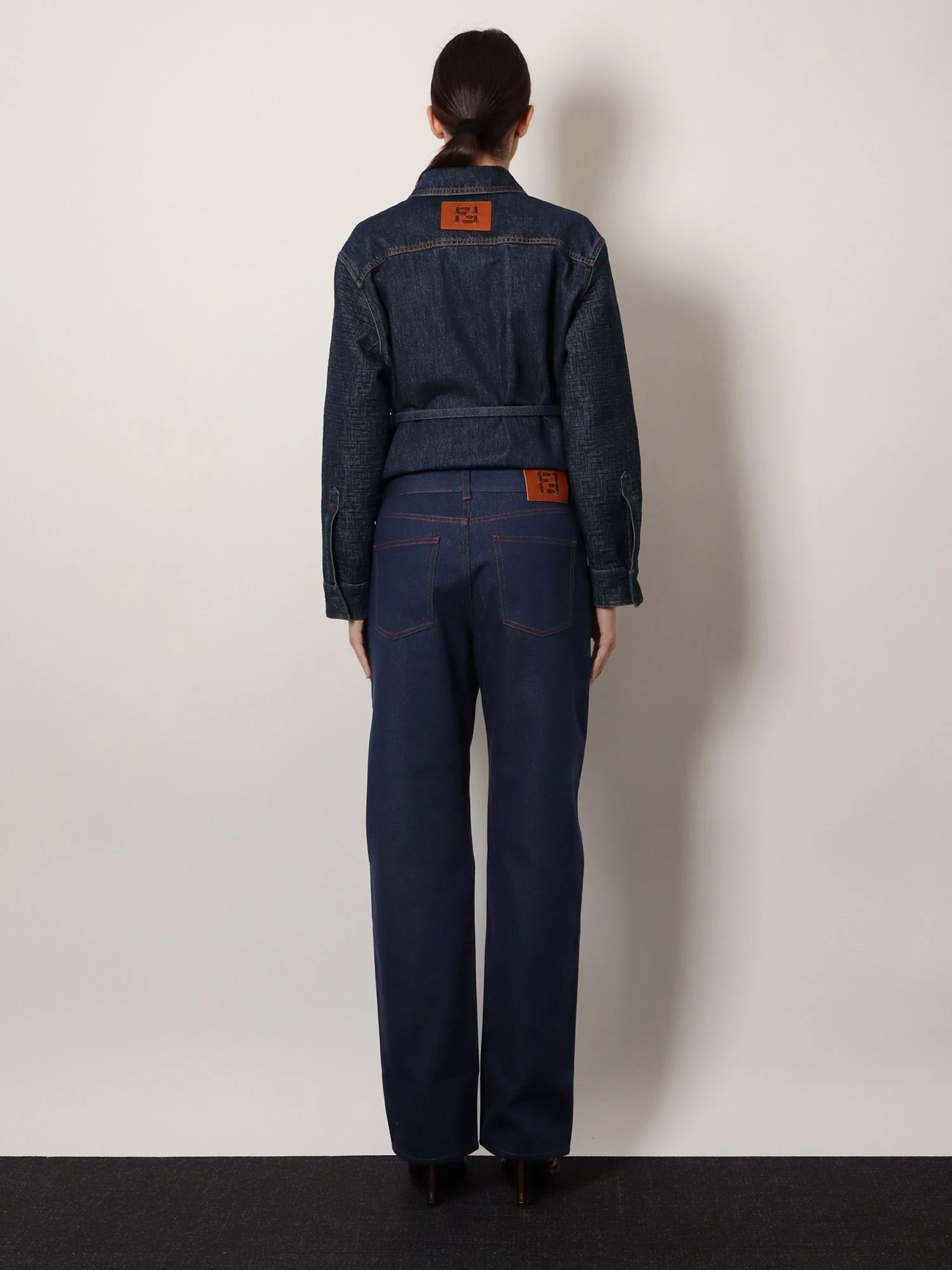 Blue denim jeans with FF detail on the bottom.webp