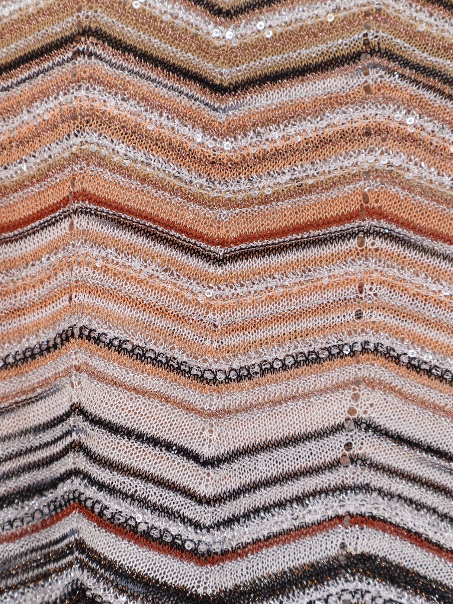 Viscose tank top with laminated chevron pattern.webp