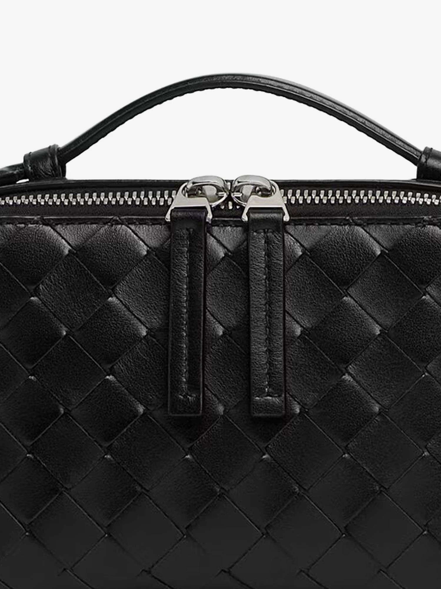 Leather clutch bag with Intrecciato motif.webp