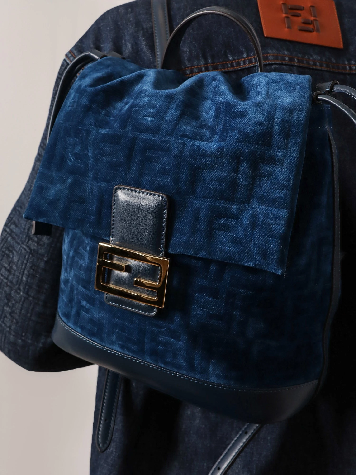 Denim backpack with flocked FF detail.webp