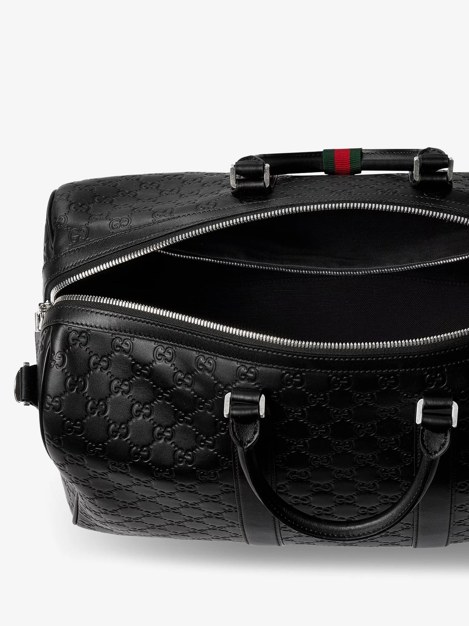 Coated canvas GG Emblem travel bag with GG motif.webp