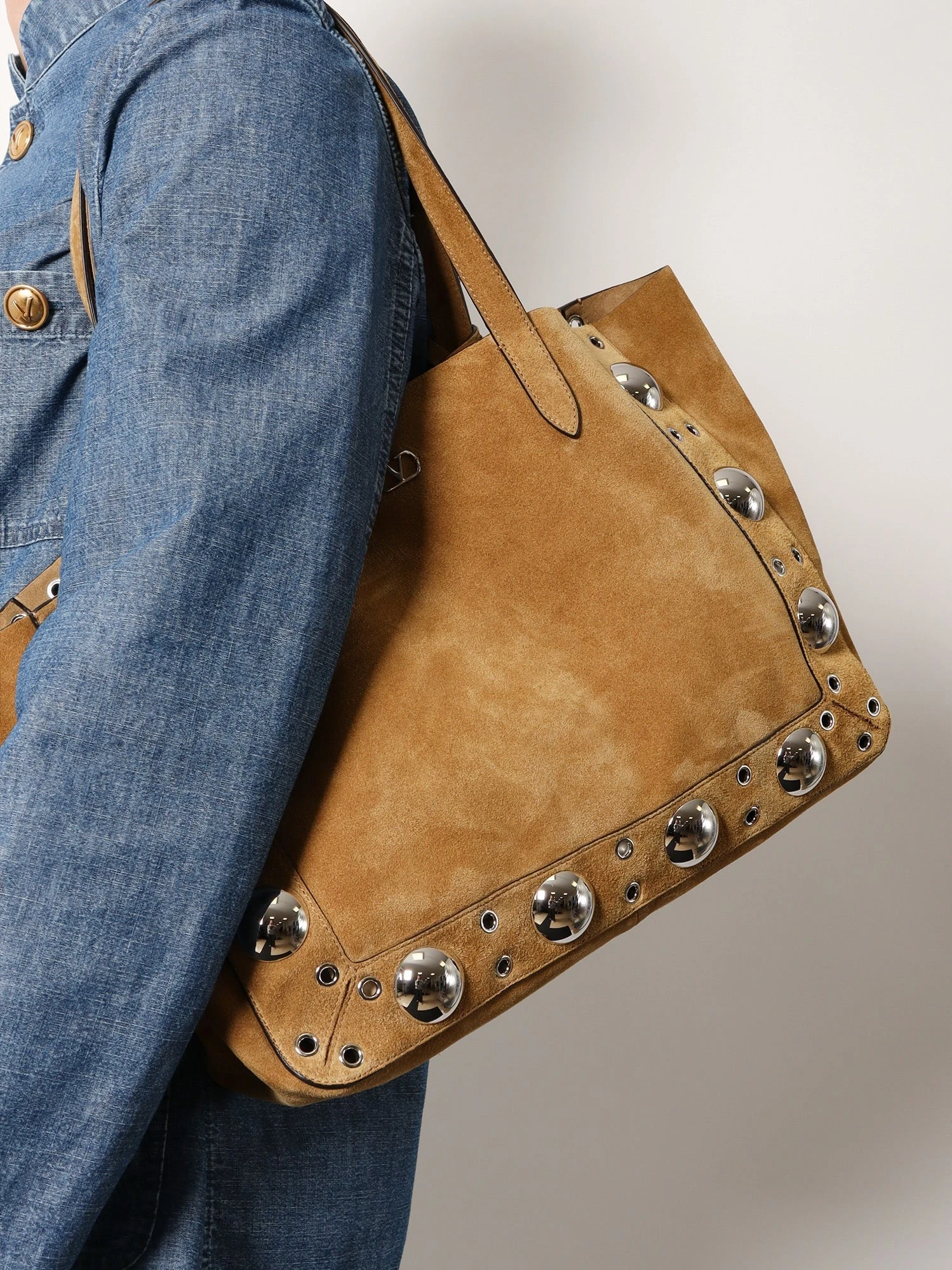 Suede shopping bag with metal logo.webp