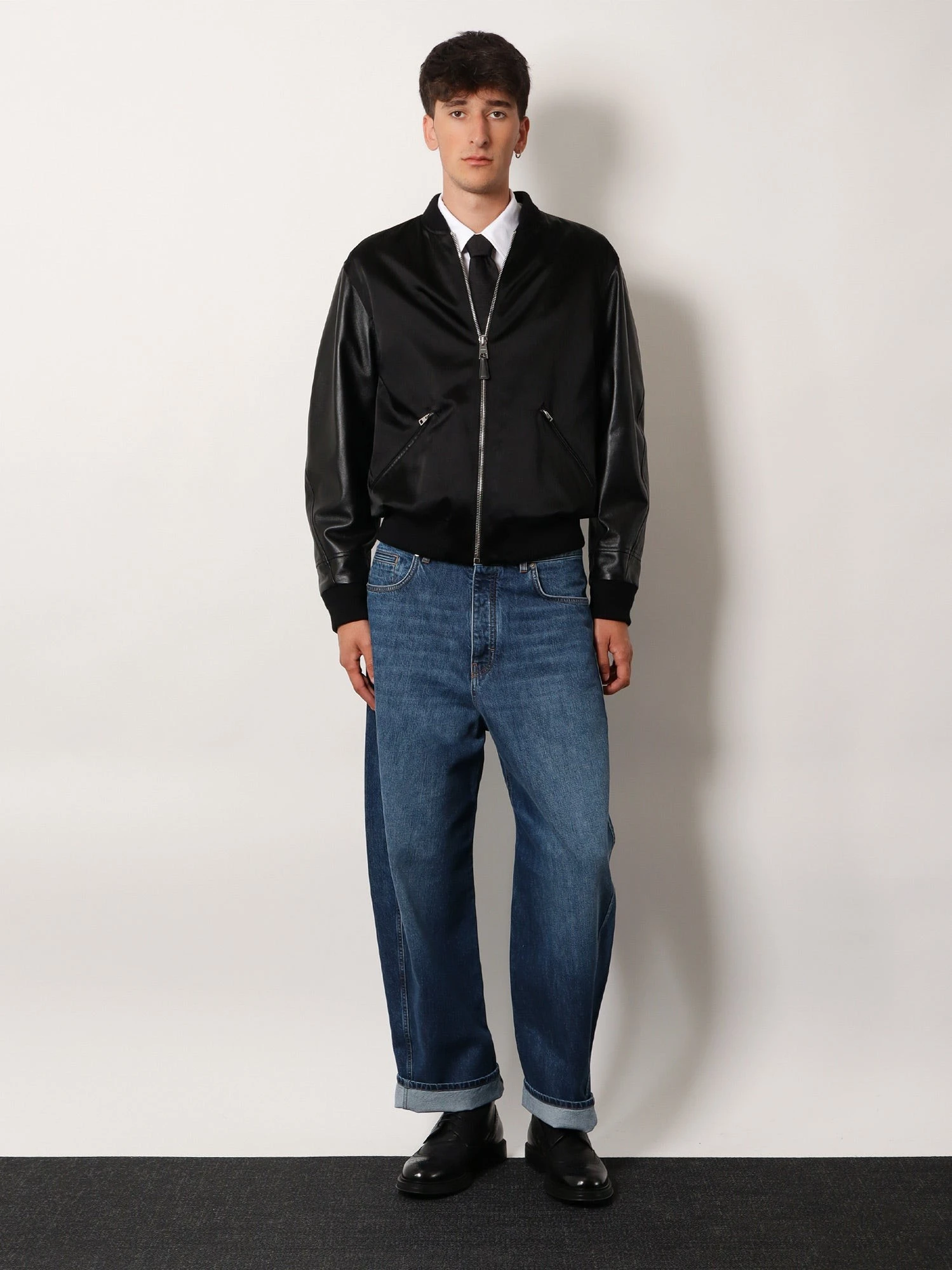 Cotton and nylon jacket with leather sleeves.webp