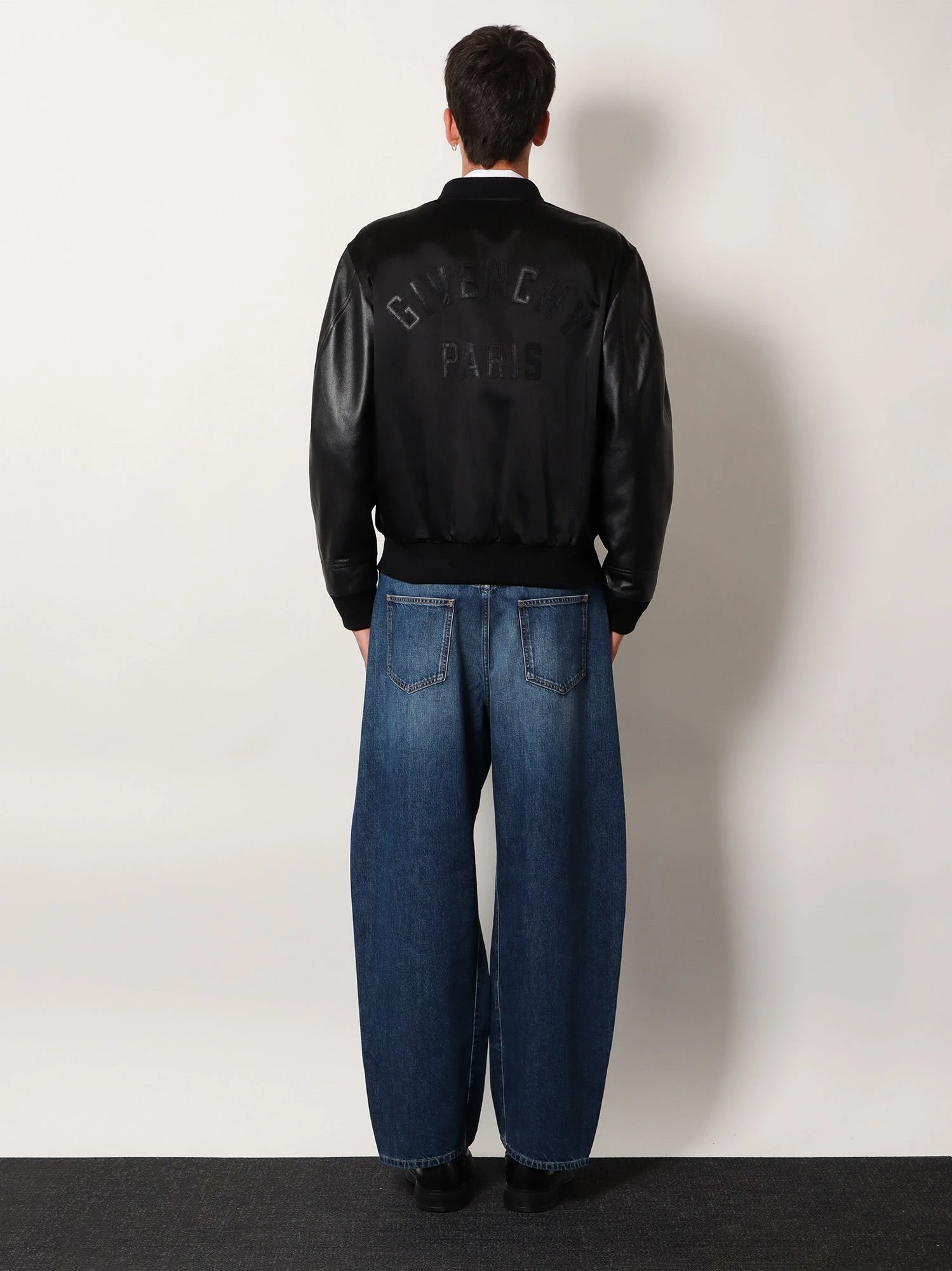 Cotton and nylon jacket with leather sleeves.webp