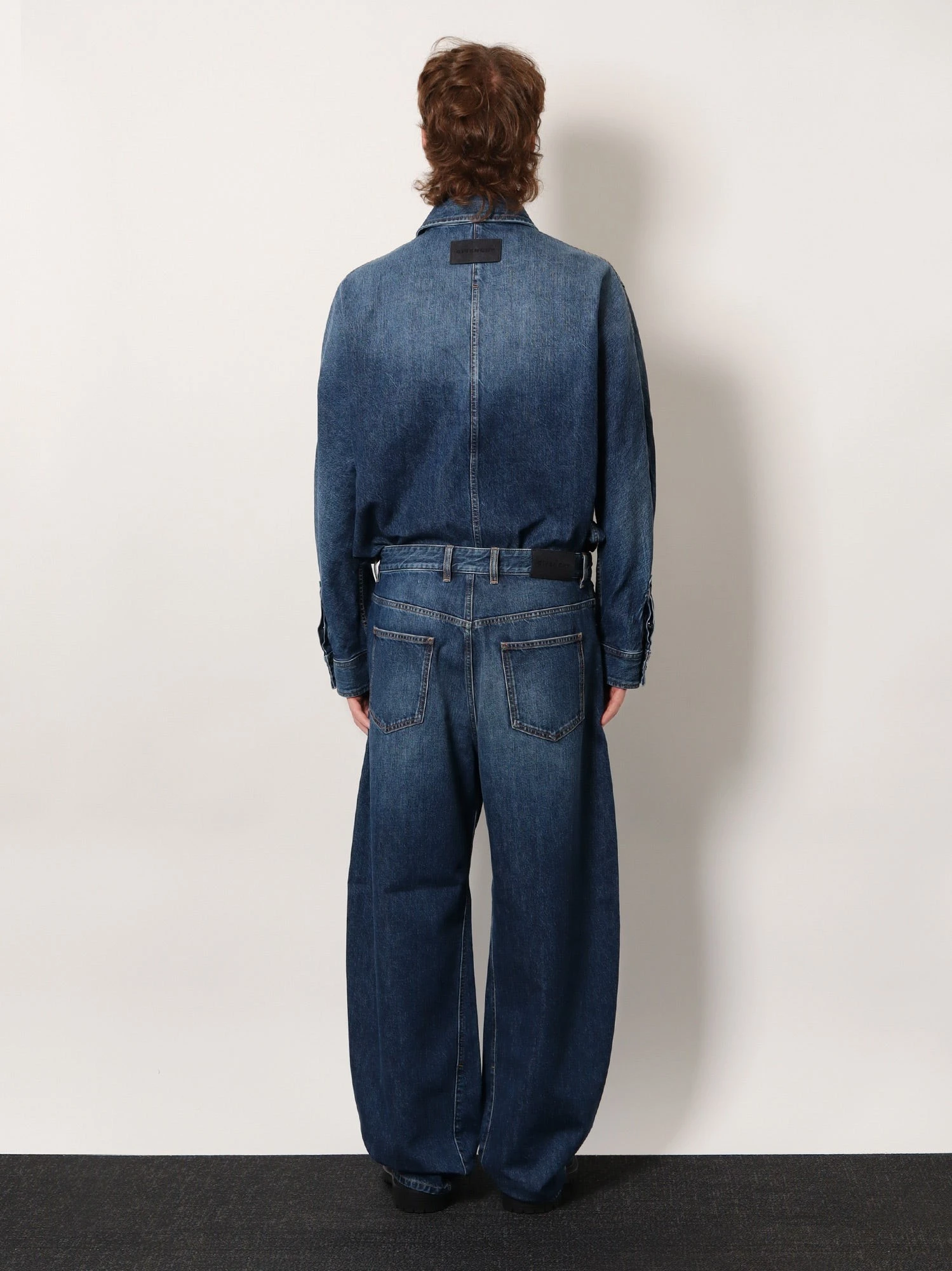 Twisted stone-washed denim jeans.webp