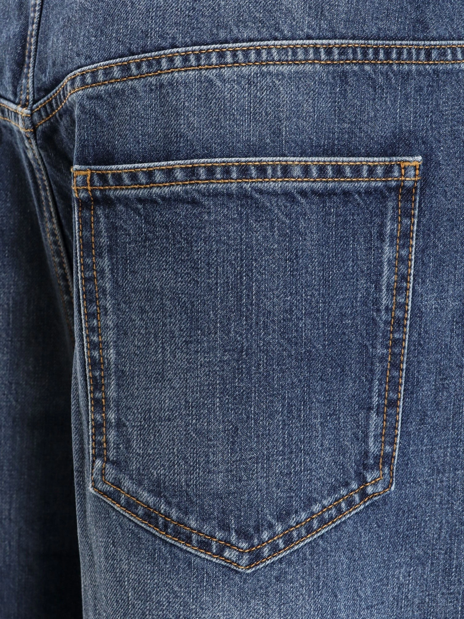 Twisted stone-washed denim jeans.webp